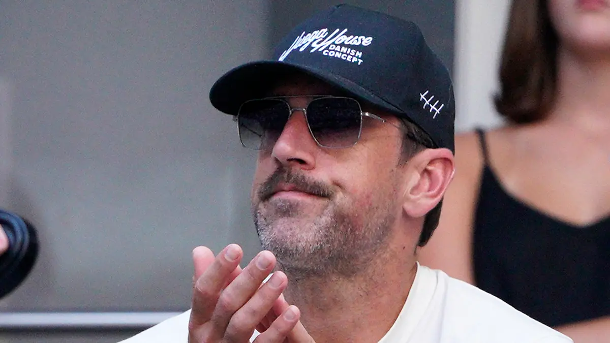 New York Jets quarterback Aaron Rodgers watches Coco Gauff, of the United States, face Caroline Wozniacki, of Denmark, during the fourth round of the U.S. Open tennis championships, Sunday, Sept. 3, 2023, in New York. (AP Photo/Eduardo Munoz Alvarez)