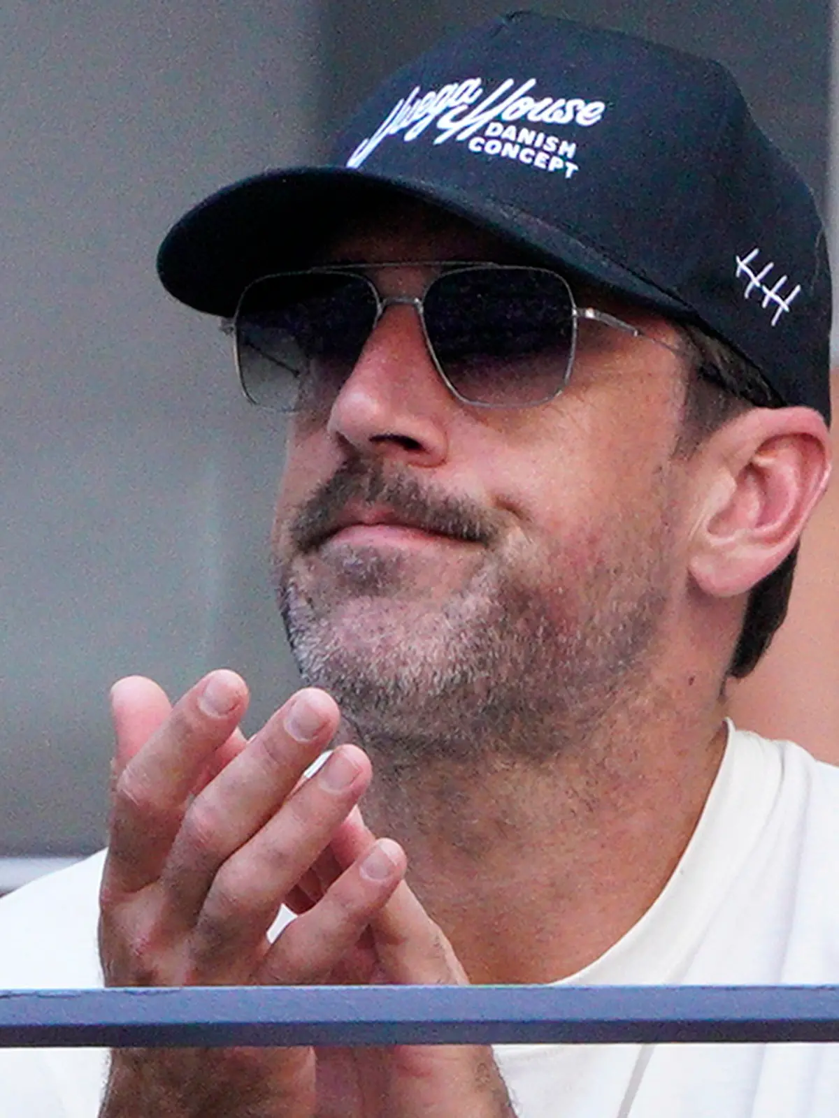 New York Jets quarterback Aaron Rodgers watches Coco Gauff, of the United States, face Caroline Wozniacki, of Denmark, during the fourth round of the U.S. Open tennis championships, Sunday, Sept. 3, 2023, in New York. (AP Photo/Eduardo Munoz Alvarez)