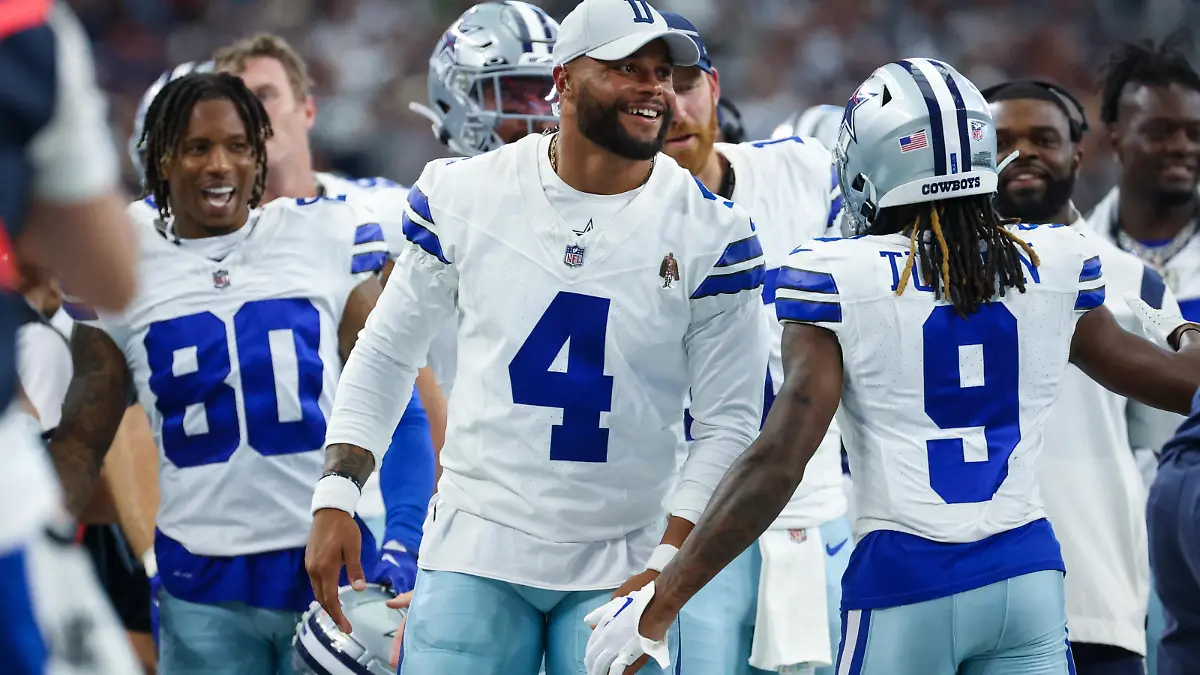 Aug 12, 2023; Arlington, Texas, USA;  Dallas Cowboys quarterback Dak Prescott (4) laughs with teammates after a touchdown  during the second quarter against the Jacksonville Jaguars at AT&T Stadium. Mandatory Credit: Kevin Jairaj-USA TODAY Sports