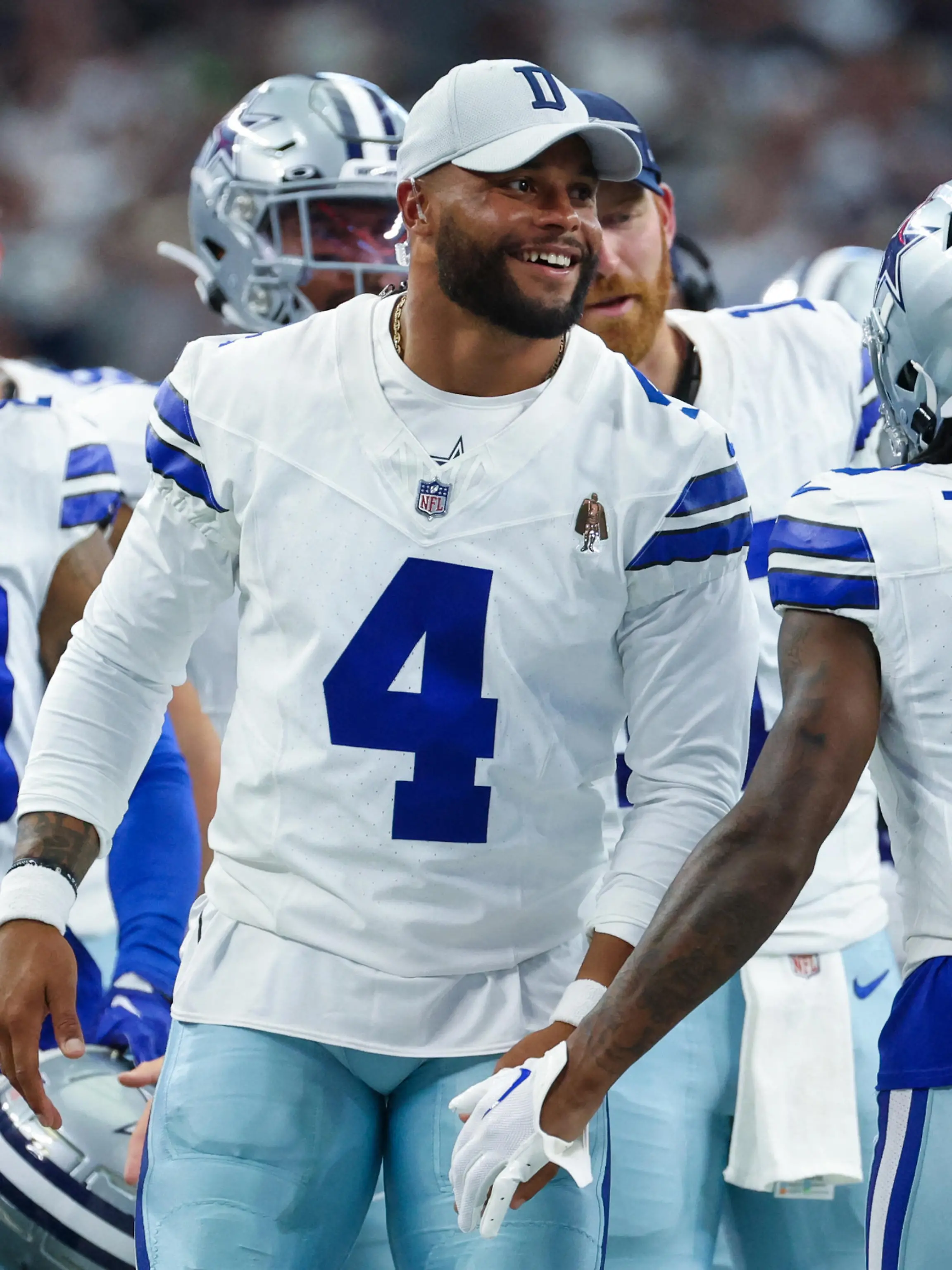 Aug 12, 2023; Arlington, Texas, USA;  Dallas Cowboys quarterback Dak Prescott (4) laughs with teammates after a touchdown  during the second quarter against the Jacksonville Jaguars at AT&T Stadium. Mandatory Credit: Kevin Jairaj-USA TODAY Sports