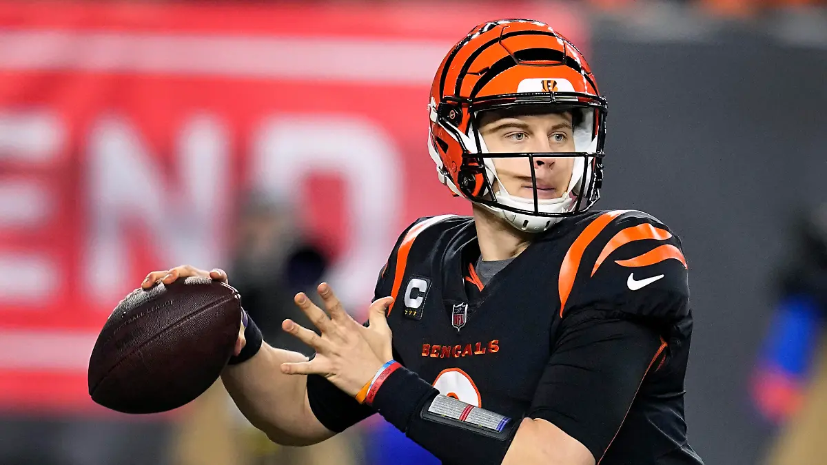 FILE - Cincinnati Bengals quarterback Joe Burrow throws in the second half of an NFL wild-card playoff football game against the Baltimore Ravens in Cincinnati, Sunday, Jan. 15, 2023. Burrow edged Josh Allen for the No. 2 spot by one point despite being left off two ballots due to his calf injury. (AP Photo/Darron Cummings, File)