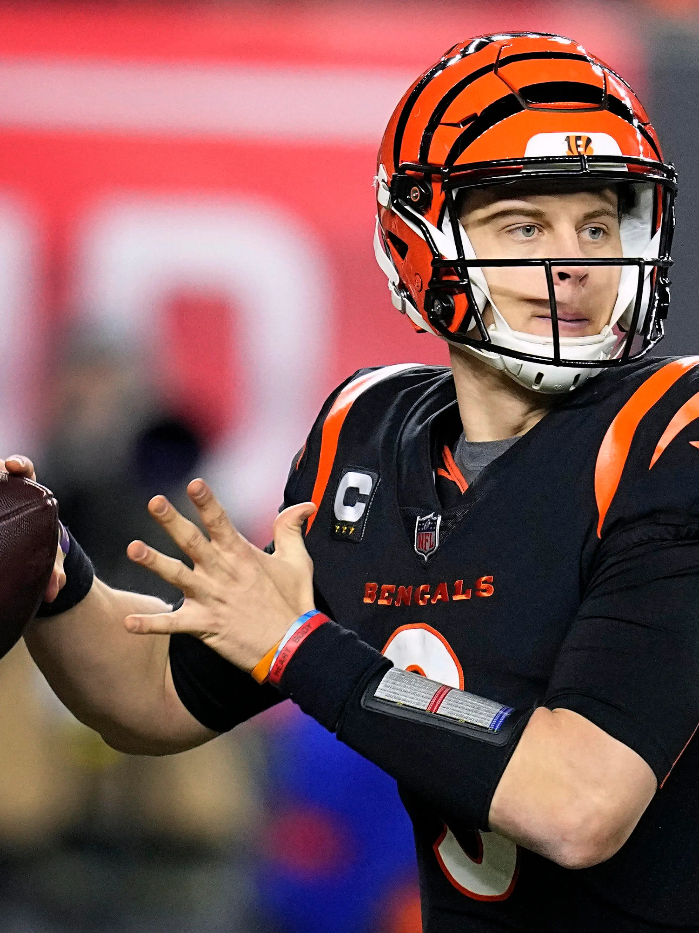 FILE - Cincinnati Bengals quarterback Joe Burrow throws in the second half of an NFL wild-card playoff football game against the Baltimore Ravens in Cincinnati, Sunday, Jan. 15, 2023. Burrow edged Josh Allen for the No. 2 spot by one point despite being left off two ballots due to his calf injury. (AP Photo/Darron Cummings, File)
