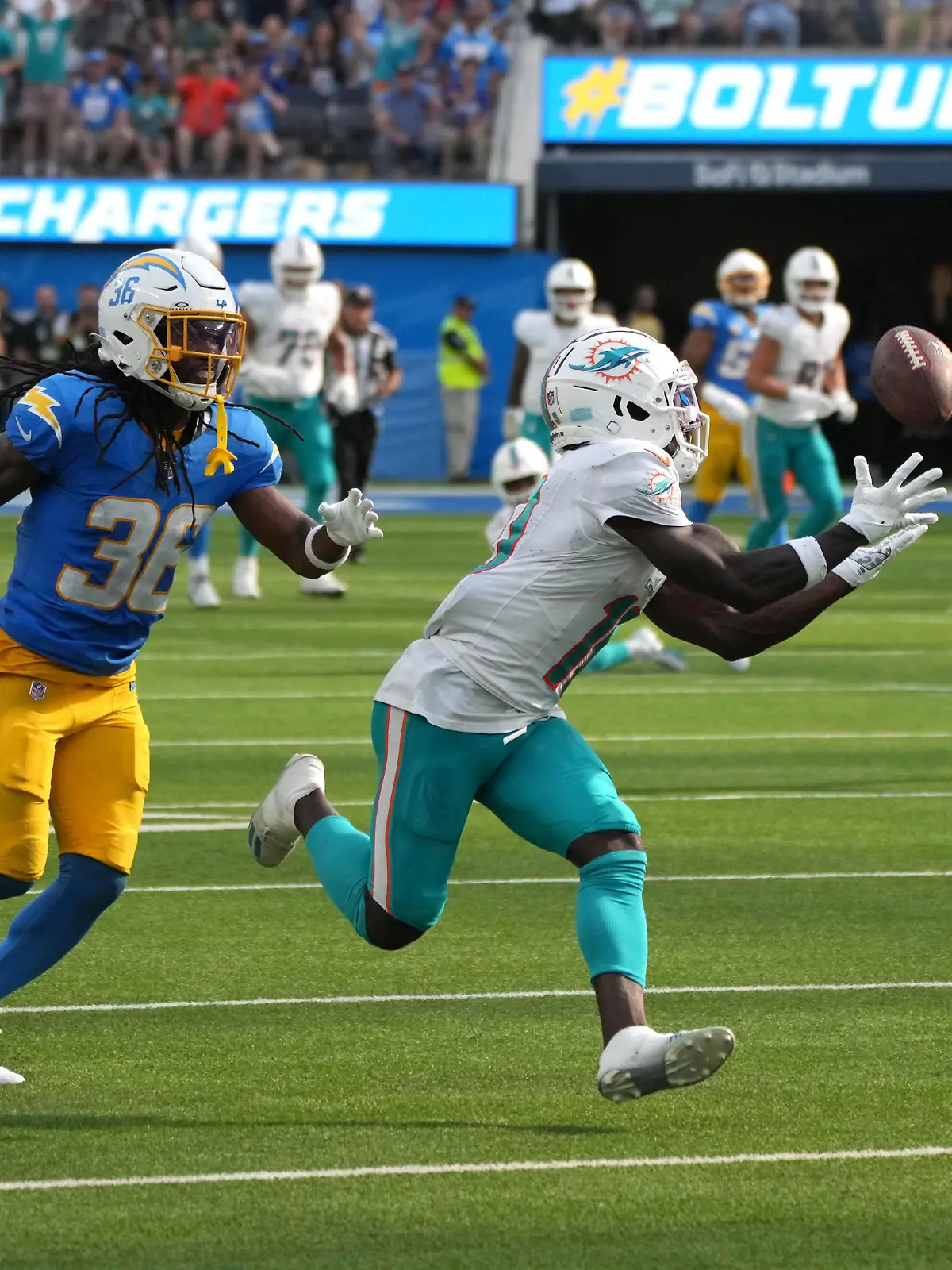Sep 10, 2023; Inglewood, California, USA; Miami Dolphins wide receiver Tyreek Hill (10) catches a 47-yard pass against Los Angeles Chargers cornerback Ja'Sir Taylor (36) in the fourth quarter at SoFi Stadium. Mandatory Credit: Kirby Lee-USA TODAY Sports