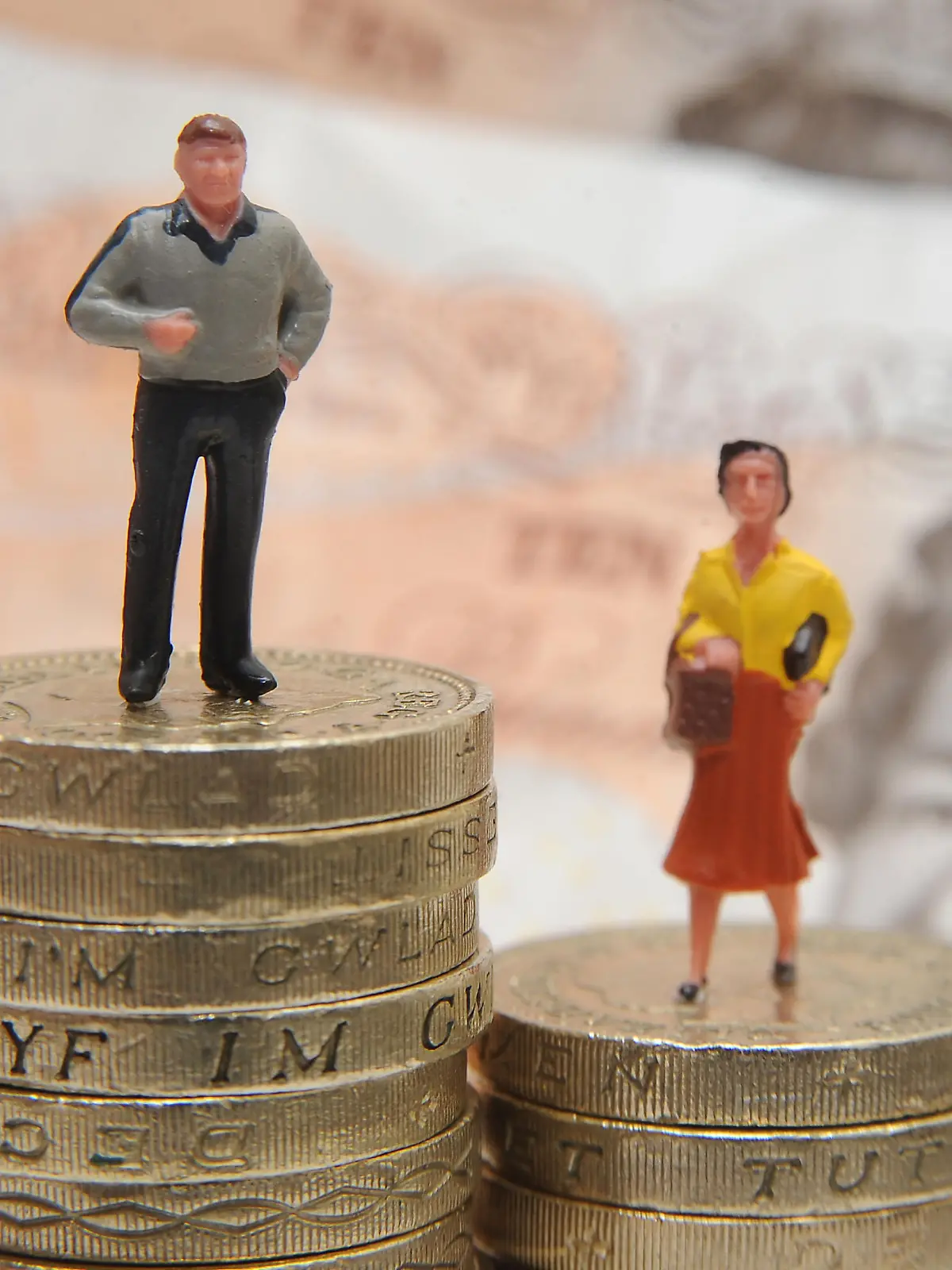 Gender pay gap. File photo dated 27/01/15 of plastic models of a man and woman standing on a pile of coins and bank notes. Men are significantly more likely than women to try to evade paying tax, researchers say. Issue date: Saturday December 23, 2017. A study of almost 1,500 people in the US, UK, Sweden and Italy found men under-report their income, while women are more honest. See PA story SOCIAL Tax. Photo credit should read: Joe Giddens/PA Wire URN:34239569 |