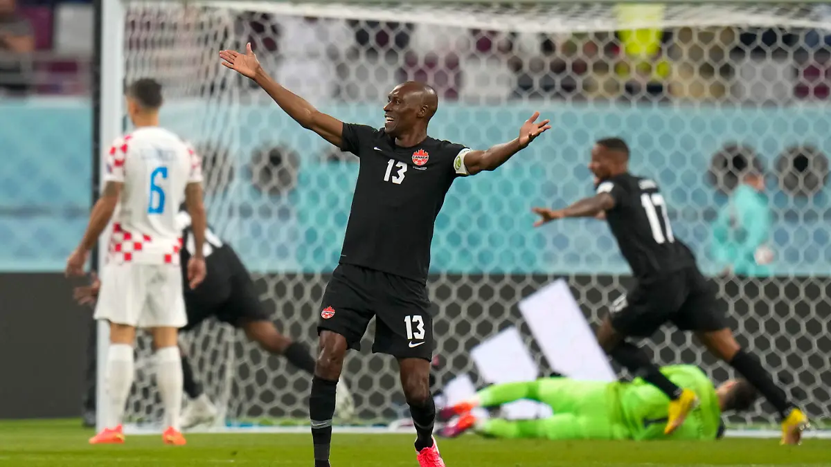 Canada's Atiba Hutchinson celebrates after Canada's Alphonso Davies scored his side's opening goal during the World Cup group F soccer match between Croatia and Canada, at the Khalifa International Stadium in Doha, Qatar, Sunday, Nov. 27, 2022. (AP Photo/Aijaz Rahi)