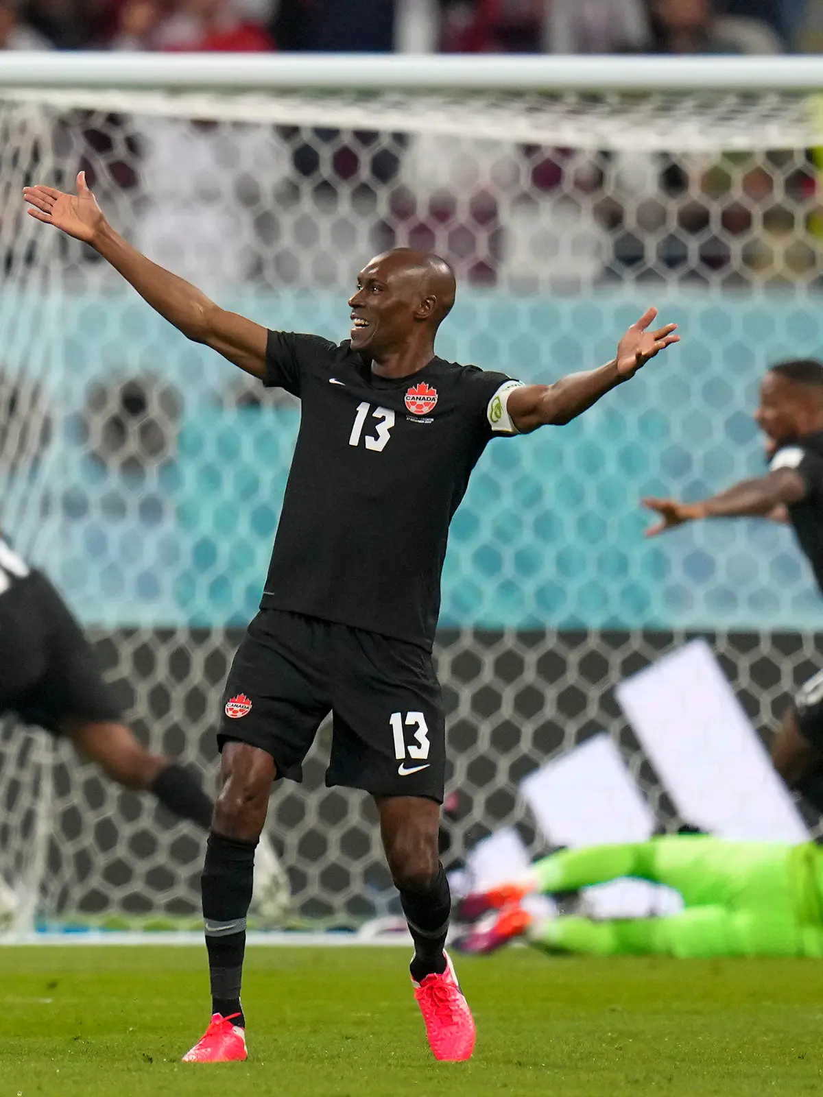Canada's Atiba Hutchinson celebrates after Canada's Alphonso Davies scored his side's opening goal during the World Cup group F soccer match between Croatia and Canada, at the Khalifa International Stadium in Doha, Qatar, Sunday, Nov. 27, 2022. (AP Photo/Aijaz Rahi)