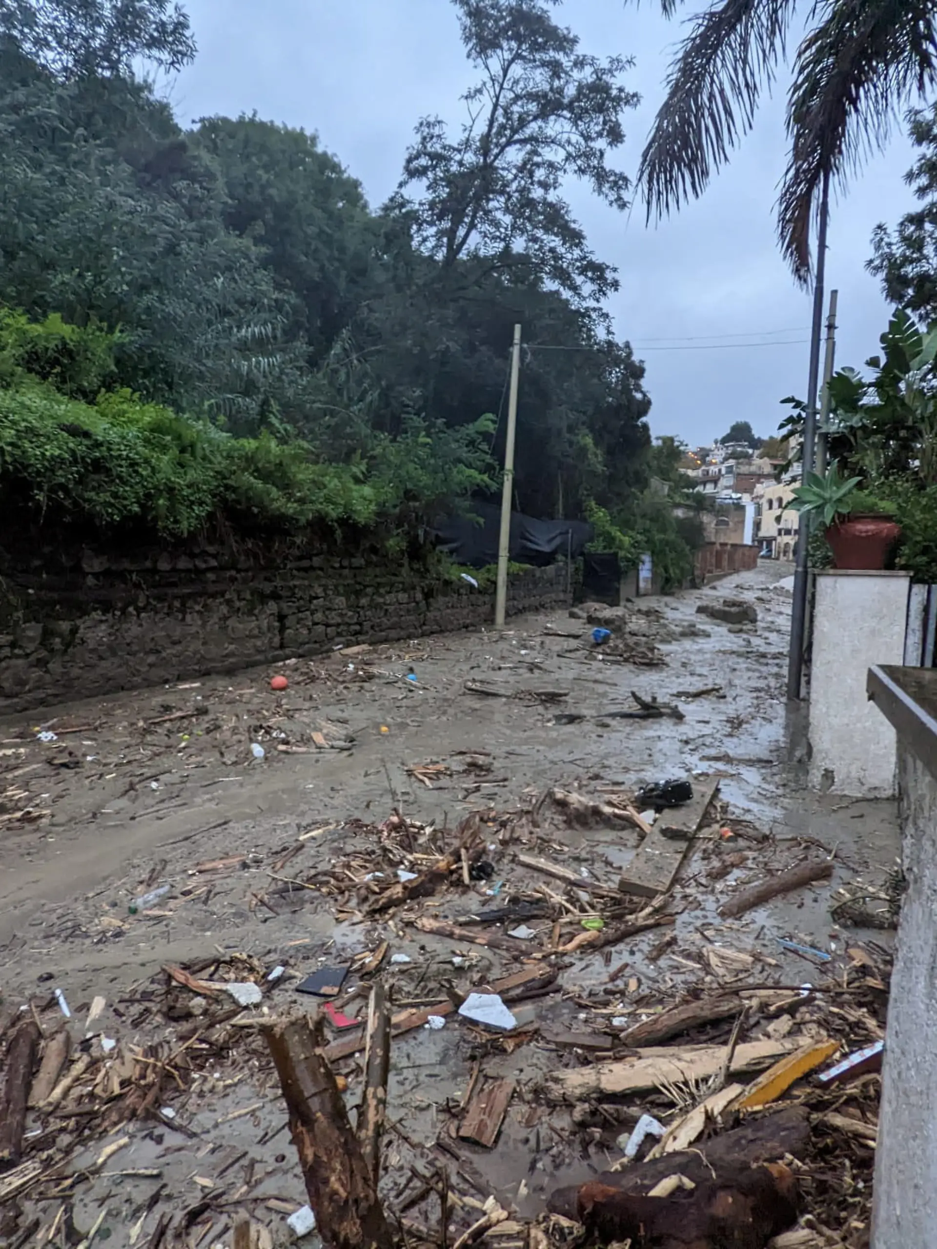 Debris are seen on the street, following a landslide on the Italian holiday island of Ischia, Italy, in this handout photo obtained by Reuters on November 26, 2022. Carabinieri/Handout via REUTERS THIS IMAGE HAS BEEN SUPPLIED BY A THIRD PARTY.