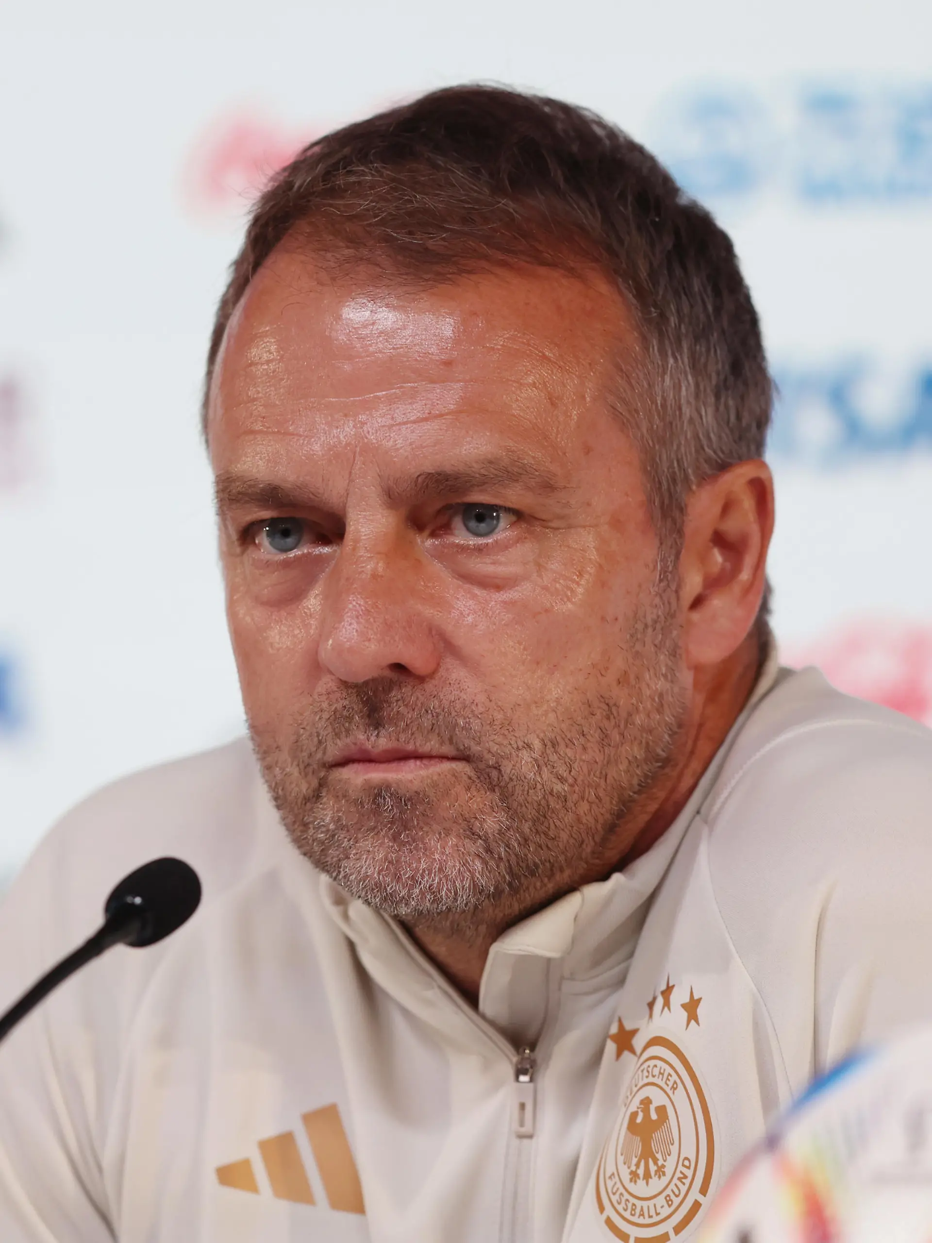 DOHA, QATAR - NOVEMBER 26: Hansi Flick, Head Coach of Germany, speaks during the Germany Press Conference at the Main Media Center on November 26, 2022 in Doha, Qatar. (Photo by Mohamed Farag/2022 Getty Images)