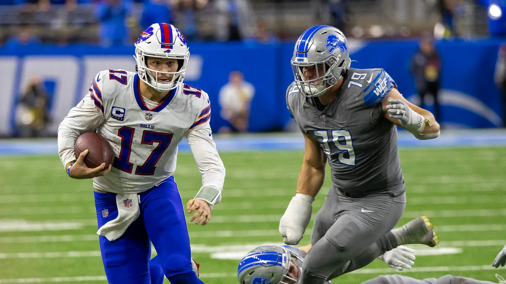 Nov 24, 2022; Detroit, Michigan, USA; Buffalo Bills quarterback Josh Allen (17) runs past Detroit Lions defensive end John Cominsky (79) during the second half at Ford Field. Mandatory Credit: David Reginek-USA TODAY Sports