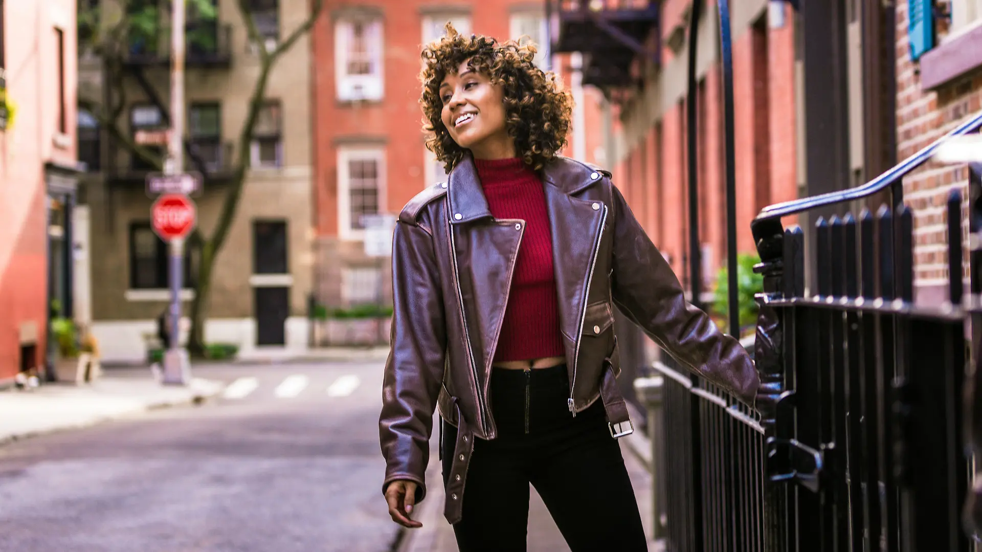 Happy african american woman smiling. Beautiful young femal walking and having fun in New York city