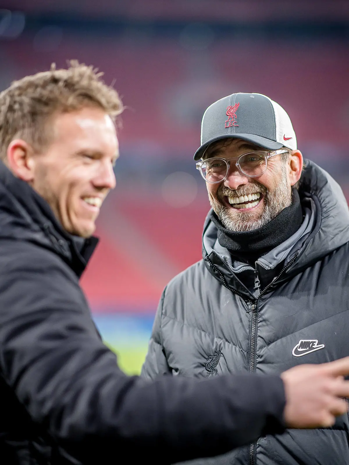 Liverpools Coach Juergen Klopp und Leipzigs Trainer Julian Nagelsmann stehen zusammen und unterhalten sich / UEFA Champions League Achtelfinale, Rueckspiel / FC Liverpool - RB Leipzig 2:0 / 10.03.2021, Puskas Arena in Budapest Ungarn. FC Liverpool - RB Leipzig *** Liverpool coach Juergen Klopp and Leipzig coach Julian Nagelsmann stand together and talk UEFA Champions League Round of 16, second leg FC Liverpool RB Leipzig 2 0 10 03 2021, Puskas Arena in Budapest Hungary FC Liverpool RB Leipzig 