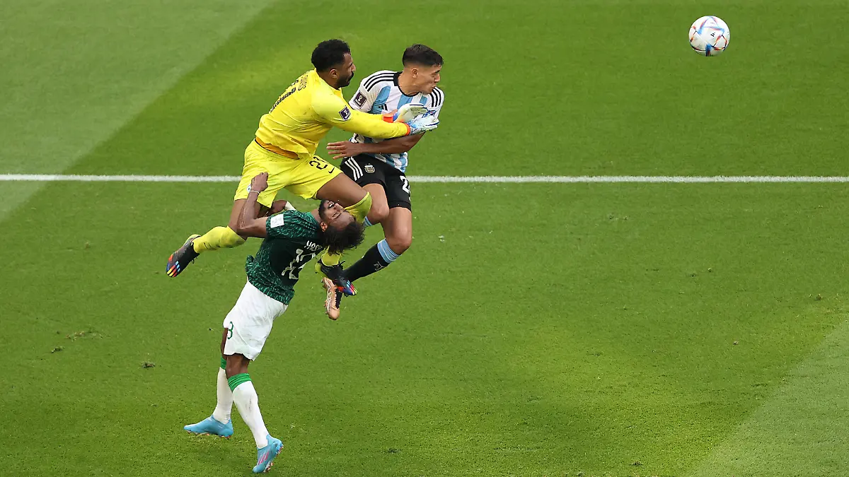 LUSAIL CITY, QATAR - NOVEMBER 22: Mohammed Al-Owais (L) of Saudi Arabia collides with teammate Yasser Al-Shahrani during the FIFA World Cup Qatar 2022 Group C match between Argentina and Saudi Arabia at Lusail Stadium on November 22, 2022 in Lusail City, Qatar. (Photo by Julian Finney/Getty Images)