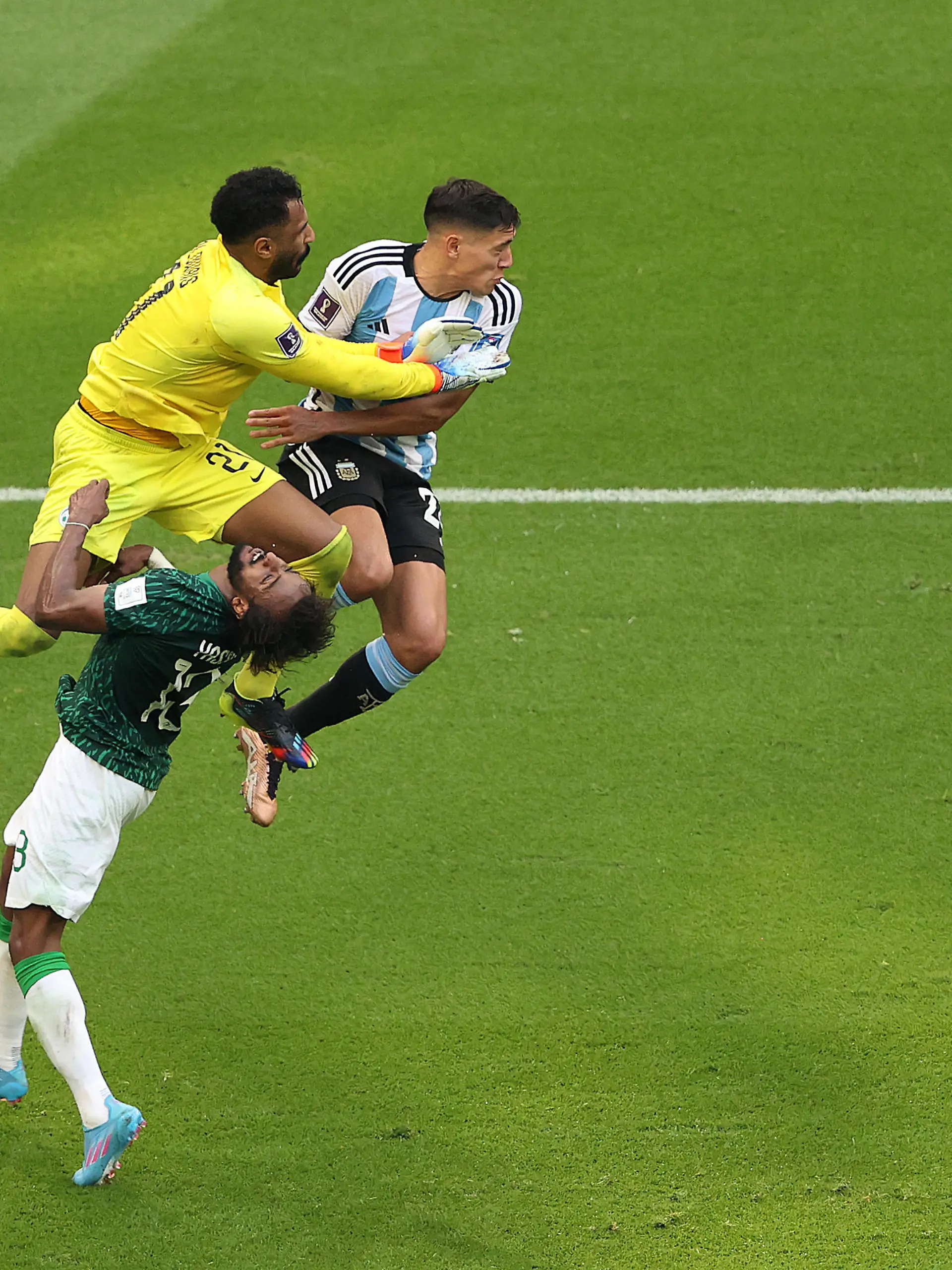 LUSAIL CITY, QATAR - NOVEMBER 22: Mohammed Al-Owais (L) of Saudi Arabia collides with teammate Yasser Al-Shahrani during the FIFA World Cup Qatar 2022 Group C match between Argentina and Saudi Arabia at Lusail Stadium on November 22, 2022 in Lusail City, Qatar. (Photo by Julian Finney/Getty Images)