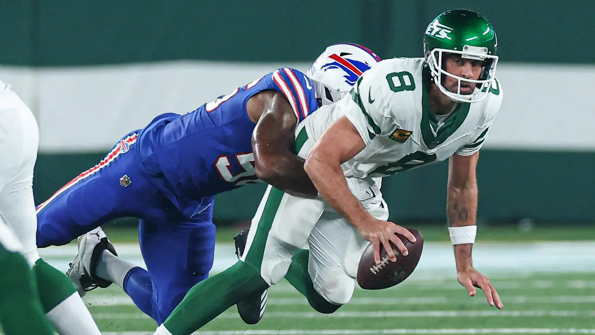 FILE PHOTO: Sep 11, 2023; East Rutherford, New Jersey, USA; New York Jets quarterback Aaron Rodgers (8) is injured while being sacked by Buffalo Bills defensive end Leonard Floyd (56) during the first half at MetLife Stadium. Mandatory Credit: Vincent Carchietta-USA TODAY Sports/File Photo