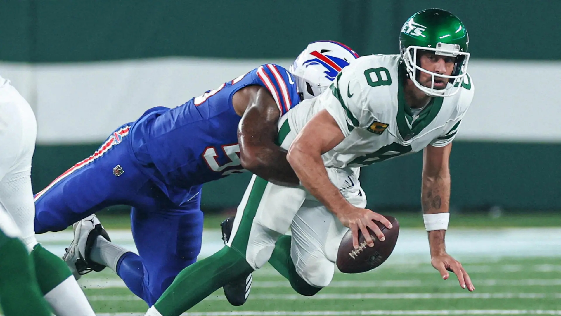 FILE PHOTO: Sep 11, 2023; East Rutherford, New Jersey, USA; New York Jets quarterback Aaron Rodgers (8) is injured while being sacked by Buffalo Bills defensive end Leonard Floyd (56) during the first half at MetLife Stadium. Mandatory Credit: Vincent Carchietta-USA TODAY Sports/File Photo