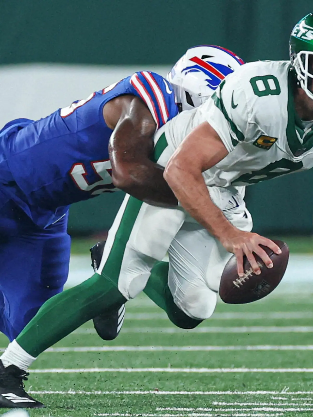 FILE PHOTO: Sep 11, 2023; East Rutherford, New Jersey, USA; New York Jets quarterback Aaron Rodgers (8) is injured while being sacked by Buffalo Bills defensive end Leonard Floyd (56) during the first half at MetLife Stadium. Mandatory Credit: Vincent Carchietta-USA TODAY Sports/File Photo