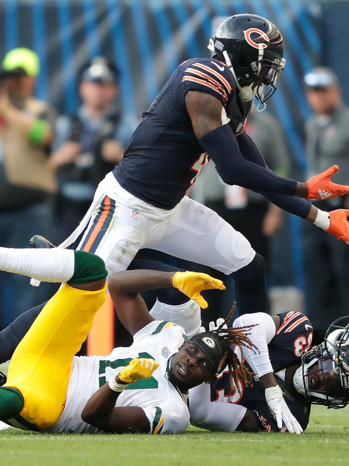 Sep 10, 2023; Chicago, Illinois, USA; Green Bay Packers wide receiver Jayden Reed (11) loses his helmet as Chicago Bears safety Eddie Jackson (4) and cornerback Jaylon Johnson (33) defend to force an incompleted pass during their football game at Soldier Field. Mandatory Credit: Dan Powers-USA TODAY Sports