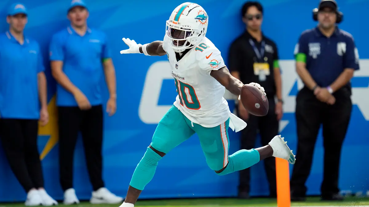 Miami Dolphins wide receiver Tyreek Hill celebrates his touchdown catch during the second half of an NFL football game against the Los Angeles Chargers Sunday, Sept. 10, 2023, in Inglewood, Calif. (AP Photo/Ashley Landis)