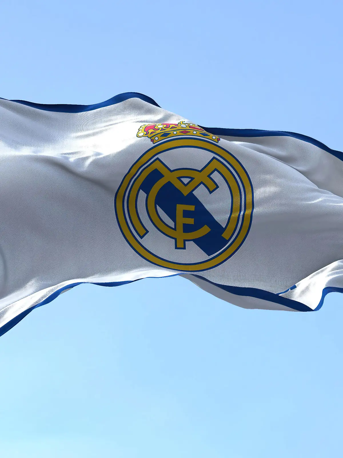 The Flag of Real Madrid waving in the wind on a clear day, Madrid, Spain, June 2022: The Flag of Real Madrid waving in the wind on a clear day. Real Madrid is a Spanish professional football club based in Madrid, Madrid, Spain, June 2022: The Flag of Real Madrid waving in the wind on a clear day. Real Madrid is a Spanish professional football club based in Madrid, 07.09.2022, Copyright: xrarrarorrox Panthermedia31820078.jpg