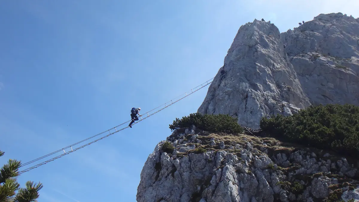 Via ferrata Donnerkogel Intersport klettersteig in Austrian Alps, Climber on 40 metres long ladder between two rock mountains xkwx nature,water,landscape,river,lake,beautiful,mountain,travel,tourism,rock,park,green,scenic,beauty,natural,forest,outdoors,sky,outdoor,view,tree,environment,blue,via ferrata,ferrata,klettersteig,rope,safety,activity,sport,adventure,adrenalin,alps,austria,climbing,danger,extreme,hill,person,snap hook,helmet,donnerkogel,ladder,intersport,rock climbing,high
