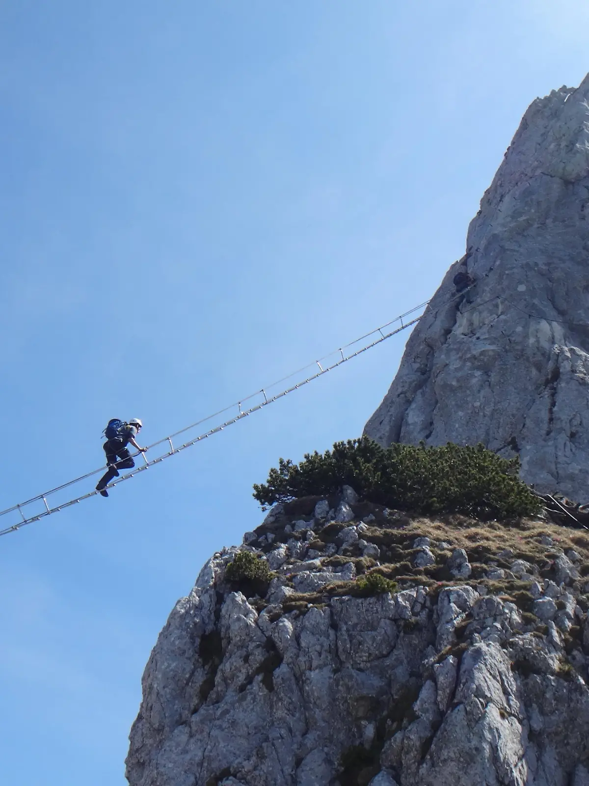 Via ferrata Donnerkogel Intersport klettersteig in Austrian Alps, Climber on 40 metres long ladder between two rock mountains xkwx nature,water,landscape,river,lake,beautiful,mountain,travel,tourism,rock,park,green,scenic,beauty,natural,forest,outdoors,sky,outdoor,view,tree,environment,blue,via ferrata,ferrata,klettersteig,rope,safety,activity,sport,adventure,adrenalin,alps,austria,climbing,danger,extreme,hill,person,snap hook,helmet,donnerkogel,ladder,intersport,rock climbing,high