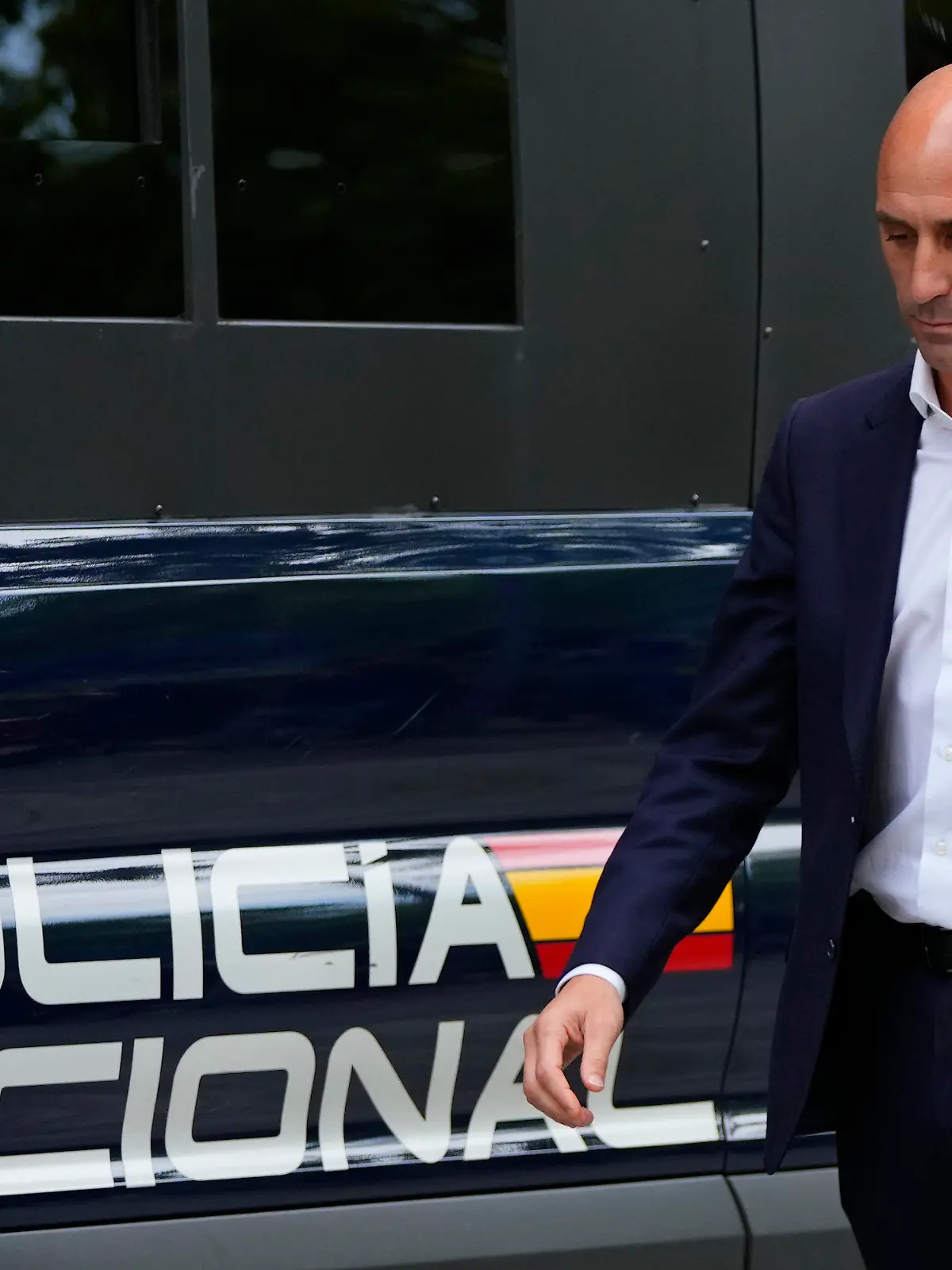 The former president of Spain's soccer federation Luis Rubiales, left, pases a police van as he leaves after testifying at the National Court in Madrid, Spain, Friday, Sept. 15, 2023. Spanish state prosecutors formally accused Rubiales last week of alleged sexual assault and an act of coercion after Rubiales kissed Spain forward Jenni Hermoso during the awards ceremony after Spain beat England to win the title on Aug. 20 in Sydney, Australia. (AP Photo/Manu Fernandez)