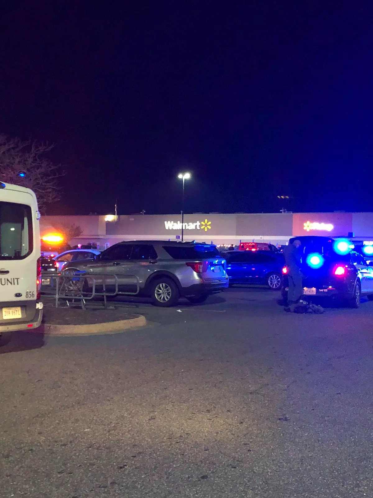 In this image from video police respond to the scene of a fatal shooting at a Walmart on Tuesday night, Nov. 22, 2022, in Chesapeake, Va. (WAVY-TV 10 via AP)