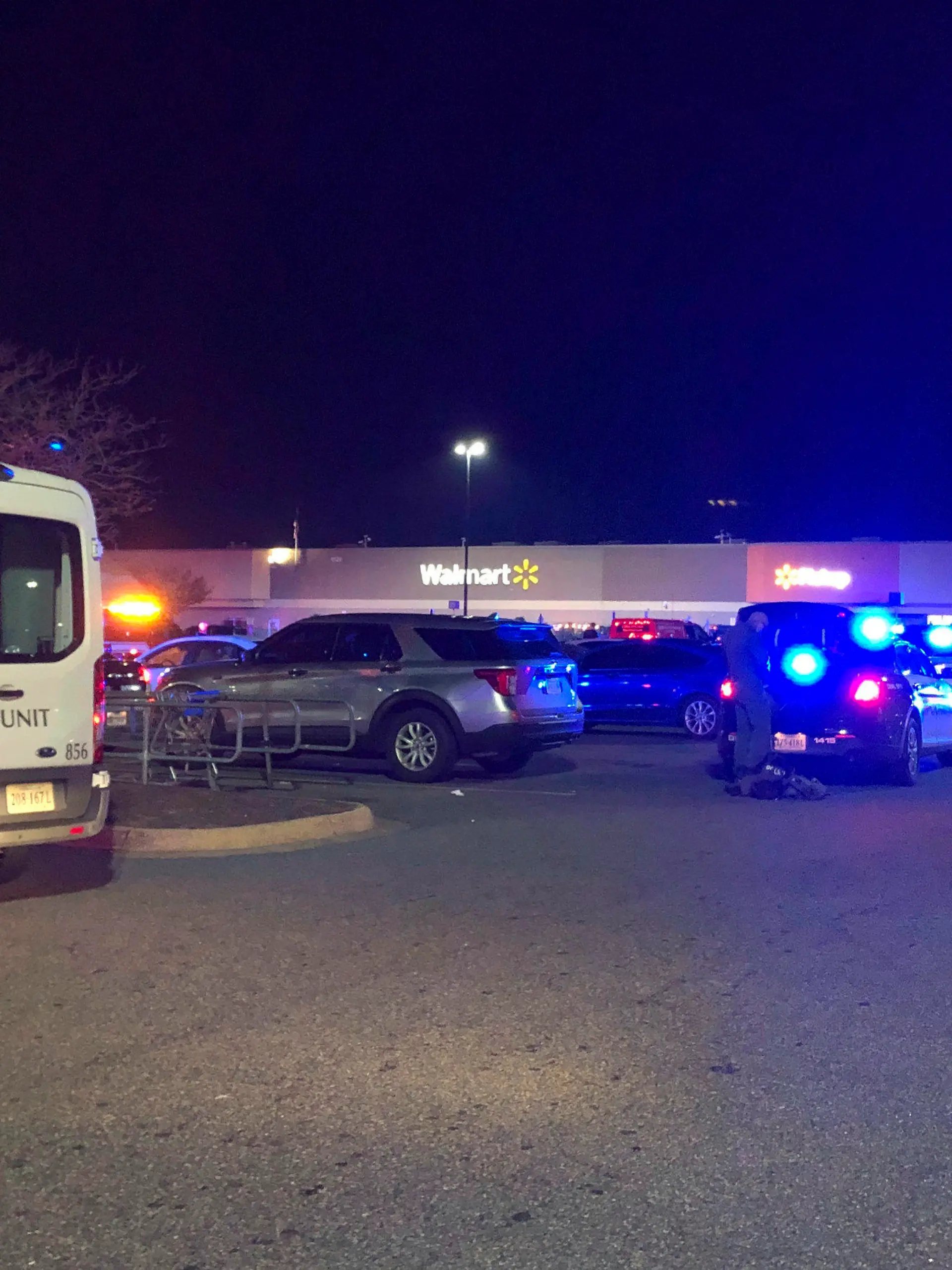In this image from video police respond to the scene of a fatal shooting at a Walmart on Tuesday night, Nov. 22, 2022, in Chesapeake, Va. (WAVY-TV 10 via AP)
