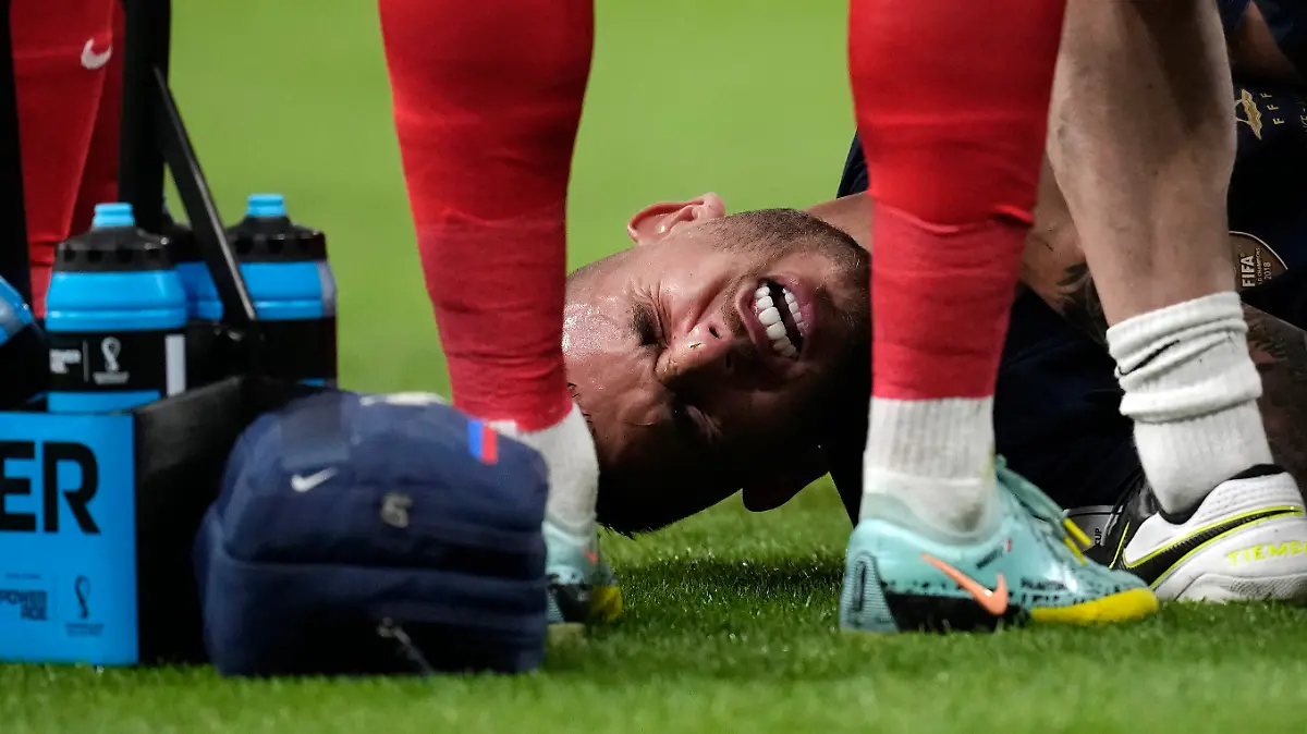 France's Lucas Hernandez is seen down injured during the World Cup group D soccer match between France and Australia, at the Al Janoub Stadium in Al Wakrah, Qatar, Tuesday, Nov. 22, 2022. (AP Photo/Christophe Ena)