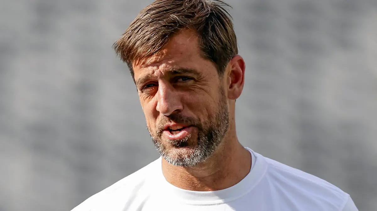 FILE - New York Jets quarterback Aaron Rodgers (8) practices before an NFL preseason football game against the New York Giants, Saturday, Aug. 26, 2023, in East Rutherford, N.J. Rodgers will make his first public media appearance, Friday, Sept. 15, since tearing the Achilles tendon in his left foot four snaps into his debut with his new team Monday night.(AP Photo/Adam Hunger, File)