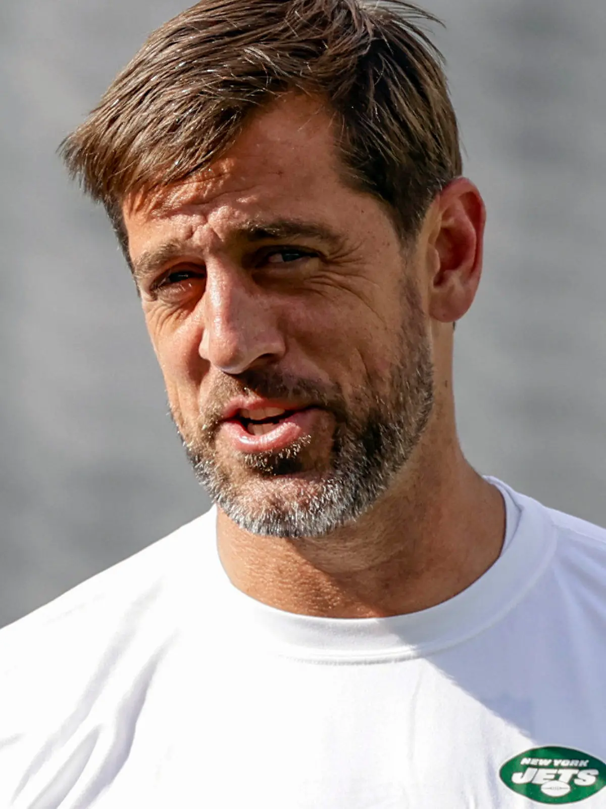 FILE - New York Jets quarterback Aaron Rodgers (8) practices before an NFL preseason football game against the New York Giants, Saturday, Aug. 26, 2023, in East Rutherford, N.J. Rodgers will make his first public media appearance, Friday, Sept. 15, since tearing the Achilles tendon in his left foot four snaps into his debut with his new team Monday night.(AP Photo/Adam Hunger, File)