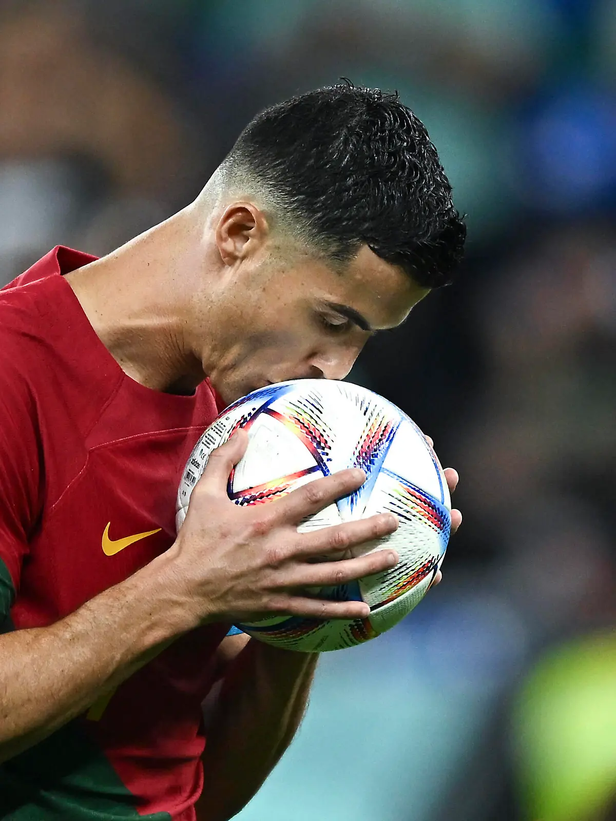  221124 -- DOHA, Nov. 24, 2022 -- Cristiano Ronaldo of Portugal kisses the ball before a penalty kick during the Group H match between Portugal and Ghana at the 2022 FIFA World Cup, WM, Weltmeisterschaft, Fussball at Ras Abu Aboud 974 Stadium in Doha, Qatar, Nov. 24, 2022.  SPQATAR-DOHA-FOOTBALL-2022 WORLD CUP-GROUP H-POR VS GHA XiaoxYijiu PUBLICATIONxNOTxINxCHN