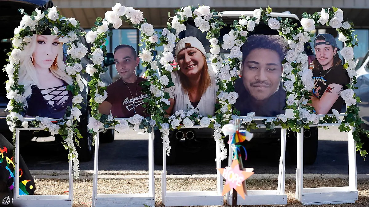 Photos of the five slain victims are displayed at a memorial site after a mass shooting at LGBTQ nightclub Club Q in Colorado Springs, Colorado, U.S. November 22, 2022.  REUTERS/Isaiah J. Downing