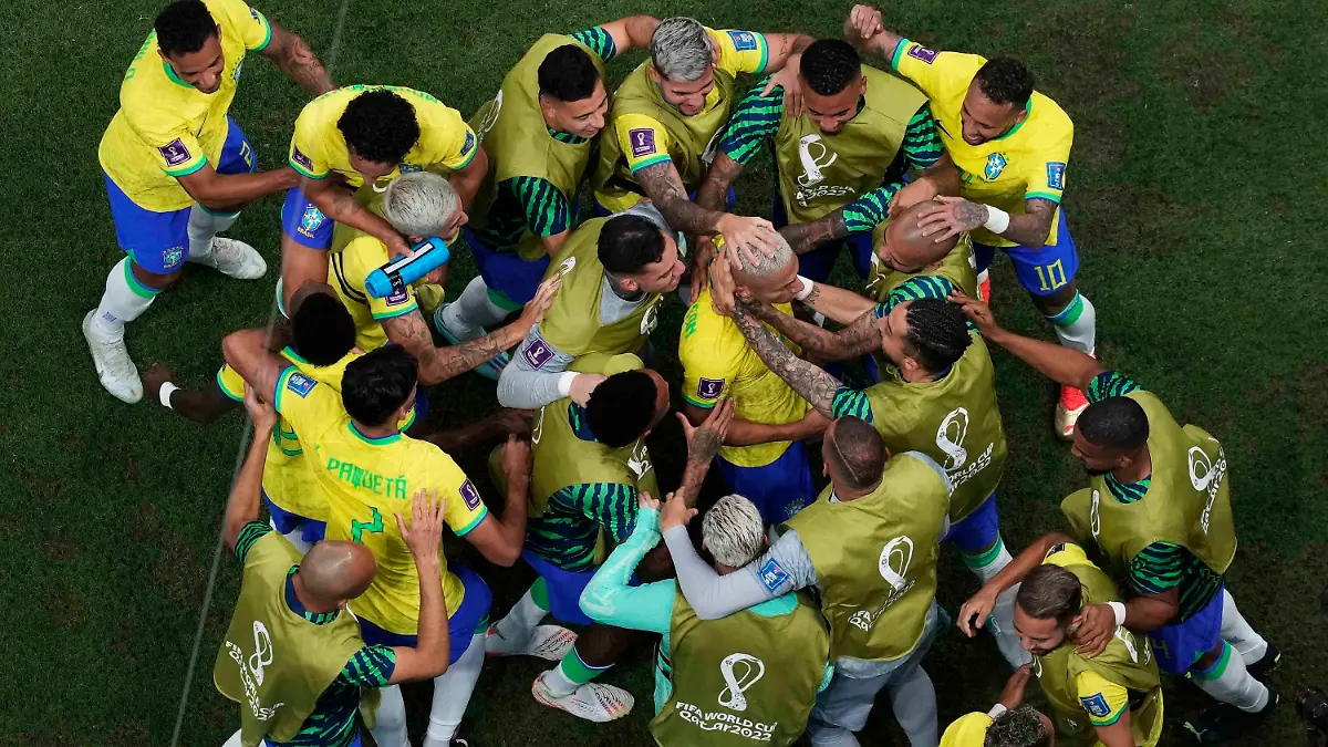 Teammates celebrate with Brazil's Richarlison after he scored his second goal during the World Cup group G soccer match between Brazil and Serbia, at the Lusail Stadium in Lusail, Qatar, Thursday, Nov. 24, 2022. (AP Photo/Thanassis Stavrakis)