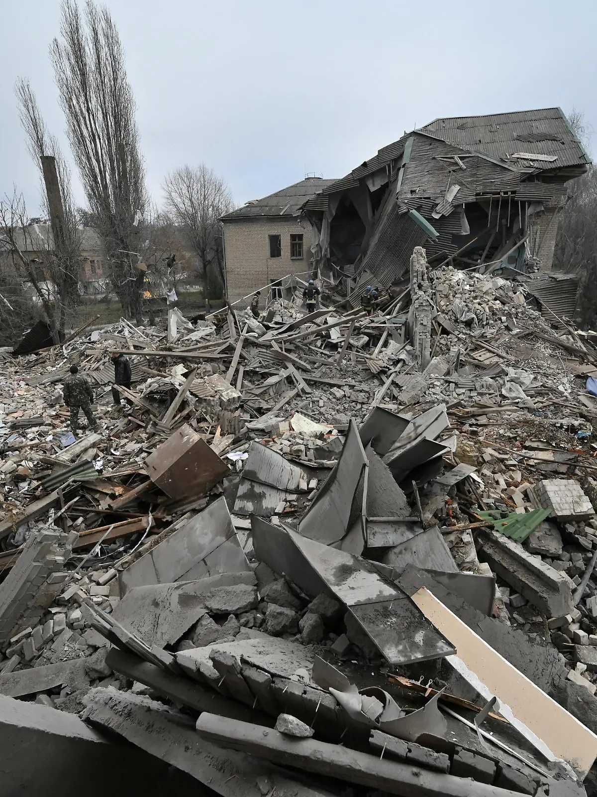 Rescuers work at the site of a maternity ward of a hospital destroyed by a Russian missile attack, as their attack on Ukraine continues, in Vilniansk, Zaporizhzhia region, Ukraine November 23, 2022.  REUTERS/Stringer