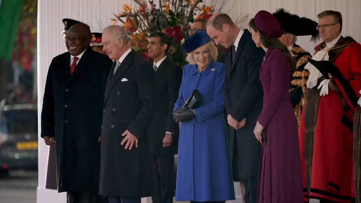 From left, President Cyril Ramaphosa of South Africa, Britain's King Charles III, Camilla, the Queen Consort, Prince William and Kate, Princess of Wales inspect a Guard of Honour during the ceremonial welcome for the state visit of the South Africa President at Horse Guards Parade in London, Tuesday Nov. 22, 2022. (Yui Mok/Pool via AP)