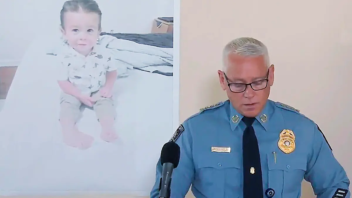 FLE - Chatham County Police Chief Jeff Hadley speaks to reporters as he stands in front of a large photo of missing toddler Quinton Simon at a police operations center being used in the search for the boy's remains just outside Savannah, Ga., on Oct. 18, 2022. Quinton's mother has been arrested in connection with the child's disappearance and presumed death, authorities said Monday, Nov. 21. (WSAV-TV via AP, File)