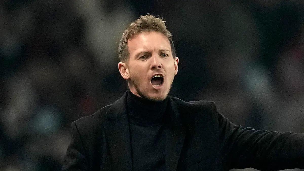 FILE - Then Bayern's head coach Julian Nagelsmann gives instructions to his players during the Champions League round of 16 first leg soccer match between Paris Saint Germain and Bayern Munich, at the Parc des Princes stadium, in Paris, France, Tuesday, Feb. 14, 2023. Germany has appointed former Bayern Munich coach Julian Nagelsmann to lead the men’s national soccer team. The German soccer federation says Nagelsmann is taking over on a short-term contract through the European Championship next summer. Germany is hosting the tournament. (AP Photo/Christophe Ena, File)