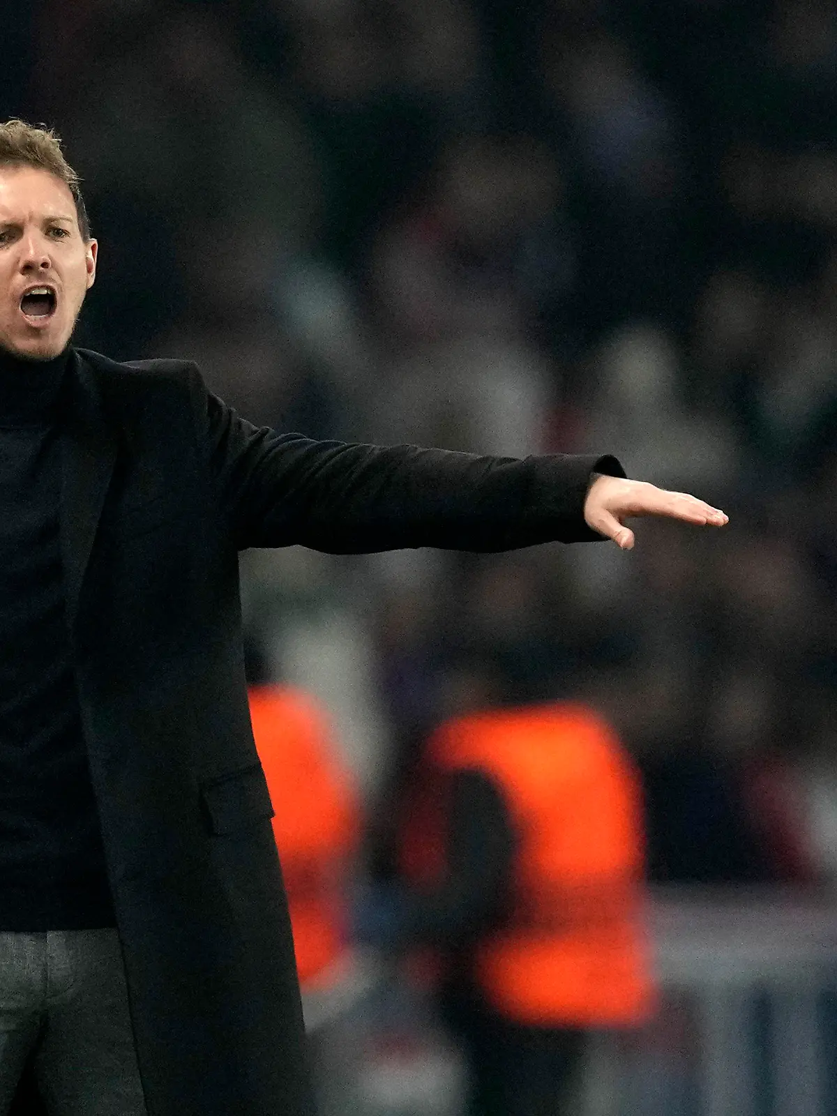 FILE - Then Bayern's head coach Julian Nagelsmann gives instructions to his players during the Champions League round of 16 first leg soccer match between Paris Saint Germain and Bayern Munich, at the Parc des Princes stadium, in Paris, France, Tuesday, Feb. 14, 2023. Germany has appointed former Bayern Munich coach Julian Nagelsmann to lead the men’s national soccer team. The German soccer federation says Nagelsmann is taking over on a short-term contract through the European Championship next summer. Germany is hosting the tournament. (AP Photo/Christophe Ena, File)