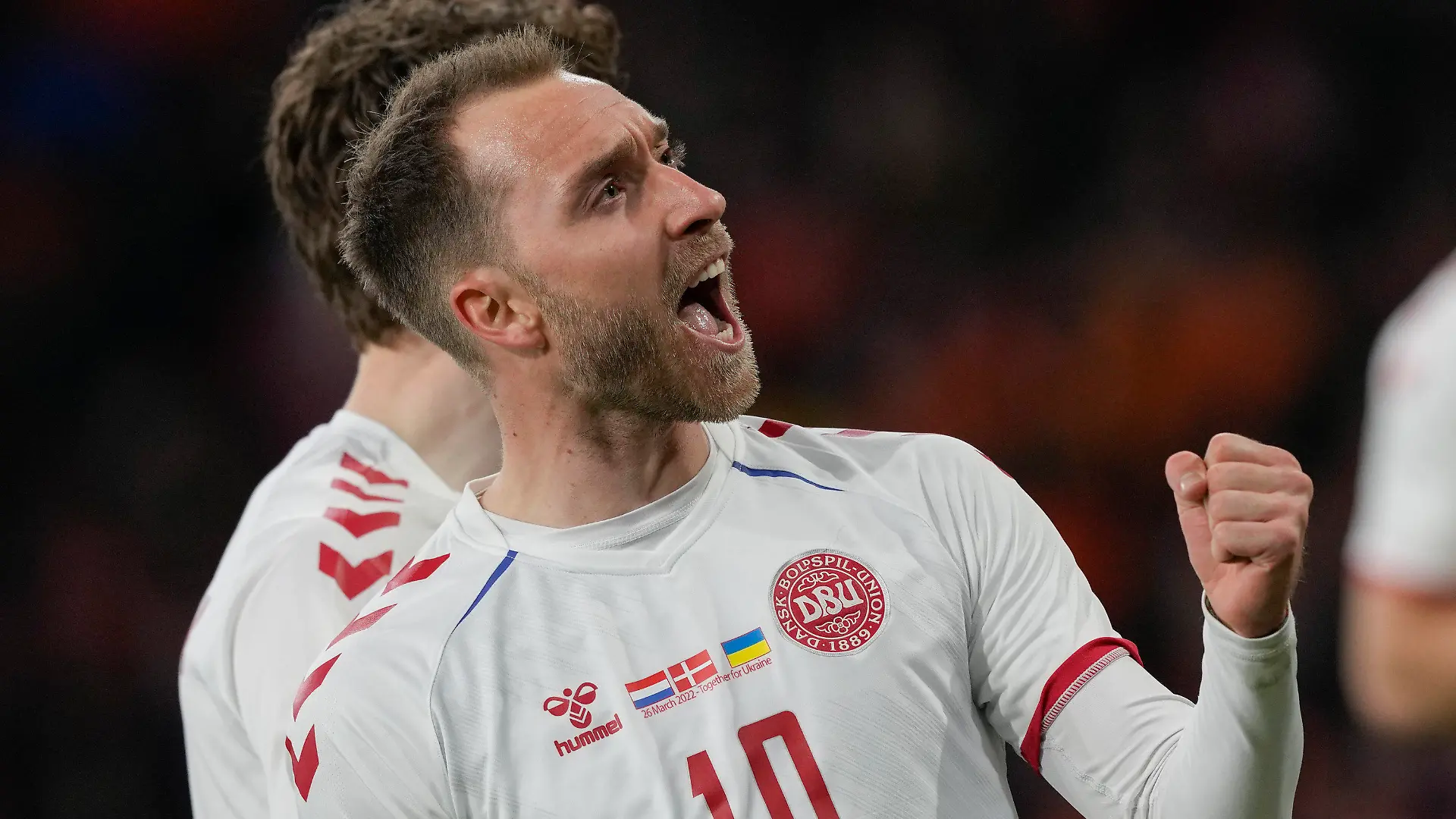 Denmark's Christian Eriksen celebrates scoring his side's second goal during the international friendly soccer match between the Netherlands and Denmark at the Johan Cruyff ArenA in Amsterdam, Netherlands, Saturday, March 26, 2022. The match was Eriksen's first appearance for Denmark since he collapsed after suffering a cardiac arrest during a European Championship game in June. (AP Photo/Peter Dejong)