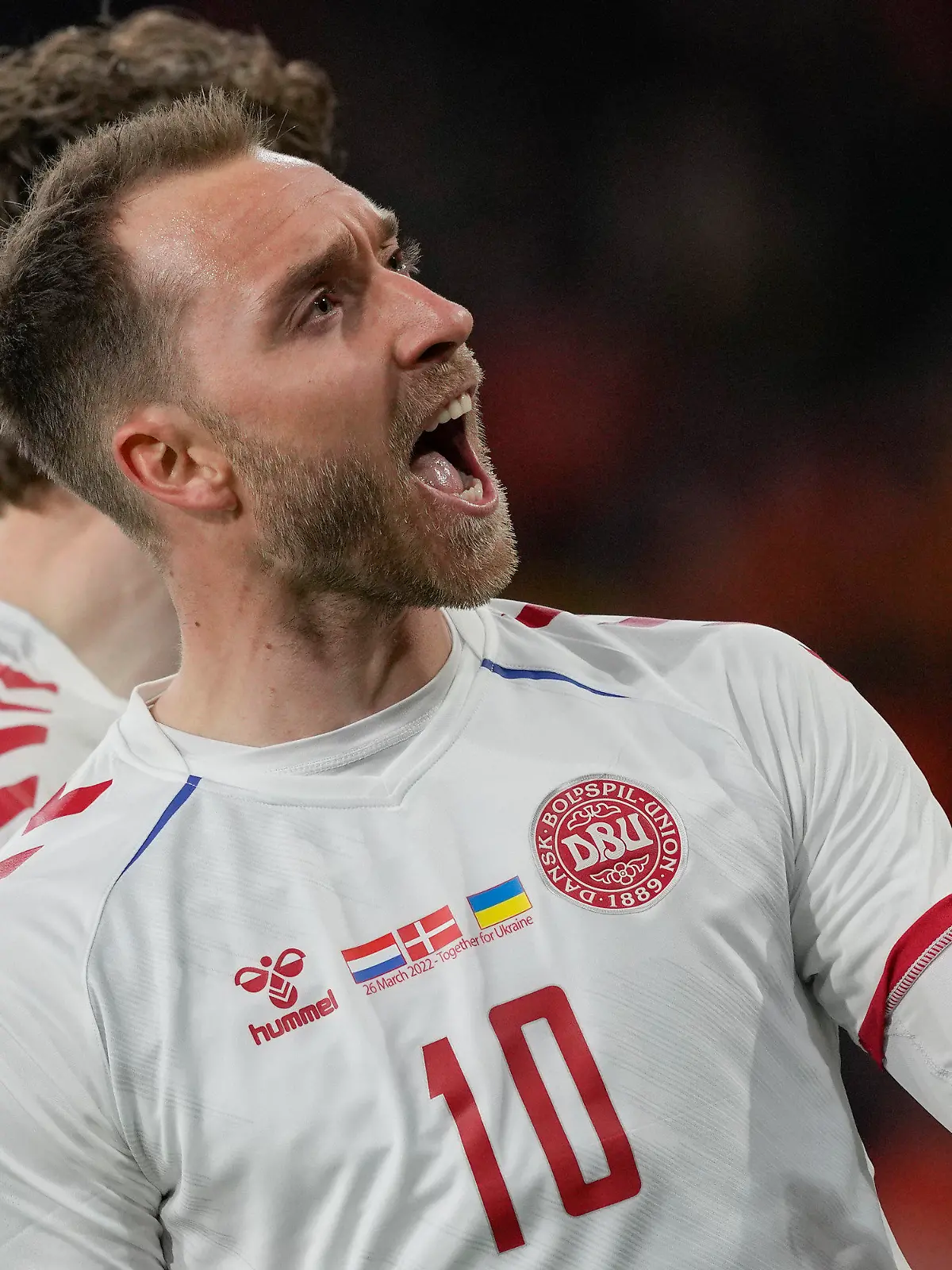Denmark's Christian Eriksen celebrates scoring his side's second goal during the international friendly soccer match between the Netherlands and Denmark at the Johan Cruyff ArenA in Amsterdam, Netherlands, Saturday, March 26, 2022. The match was Eriksen's first appearance for Denmark since he collapsed after suffering a cardiac arrest during a European Championship game in June. (AP Photo/Peter Dejong)