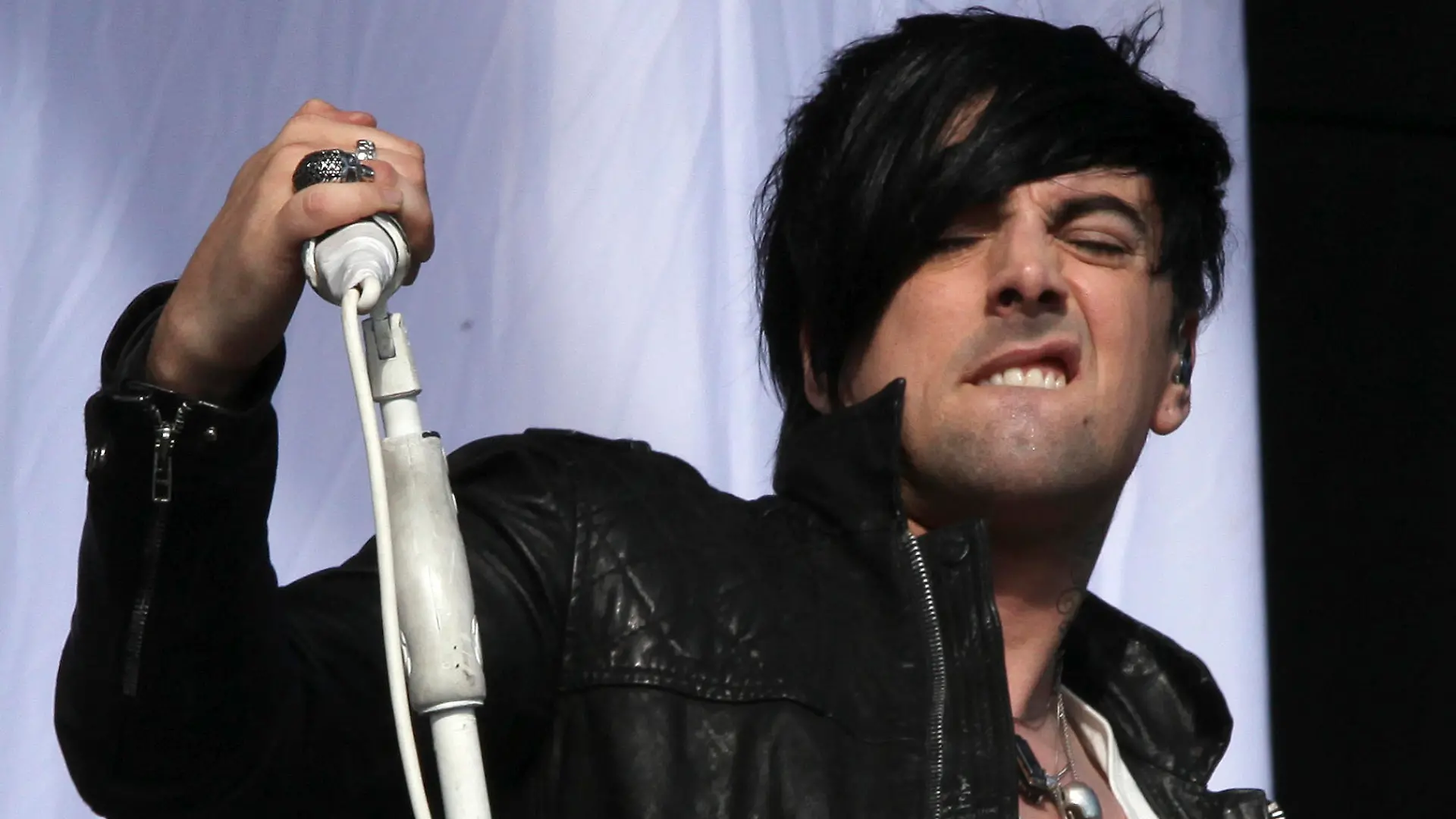 FILE This is a Saturday, Aug 20, 2011 file photo of British musician Ian Watkins, lead singer of Lostprophets, as he performs on stage at V Music Festival in Hylands Park, Chelmsford, England. Watkins the lead singer of British rock band Lostprophets appeared in court Wednesday Dec. 19, 2012 charged with child sex offenses including conspiring with a woman to rape a 1-year-old girl. (AP Photo/Joel Ryan, File)