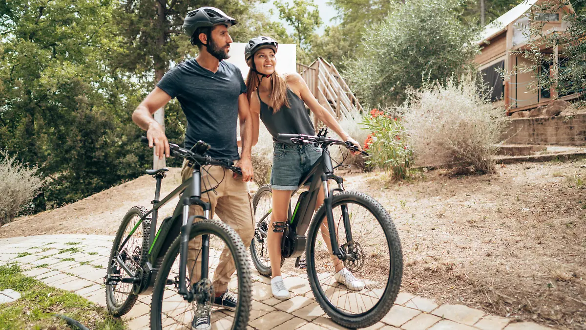 happiness couple with mountain ebike outdoors