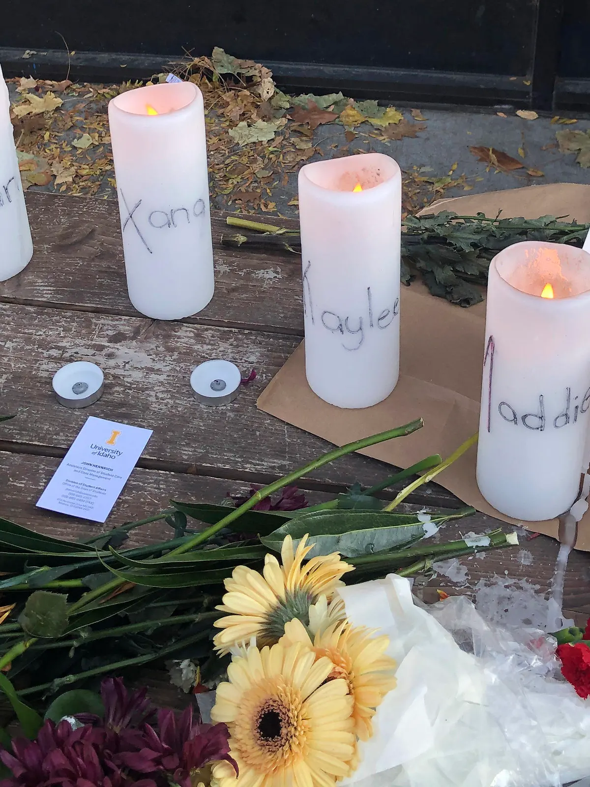 Candles and flowers are left at a make-shift memorial honoring four slain University of Idaho students outside the Mad Greek restaurant in downtown Moscow, Idaho, on Tuesday, Nov. 15, 2022. Police discovered the bodies of the four students at home near campus on Sunday, Nov. 13, 2022, and said the killer or killers used a knife or bladed weapon in the targeted attack. Two of the victims, 21-year-old Madison Mogen and 20-year-old Xana Kernodle, were servers at Mad Greek. (AP Photo/Nicholas K. Geranios)