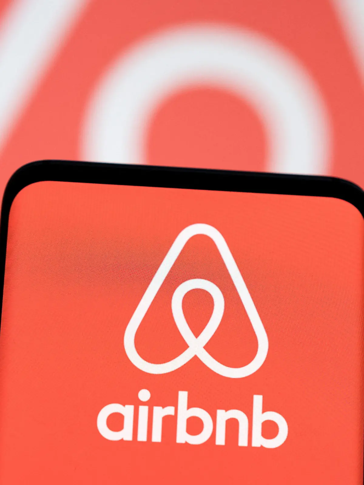 FILE PHOTO: Airbnb logo is seen displayed in this illustration taken, May 3, 2022. REUTERS/Dado Ruvic/Illustration/File Photo