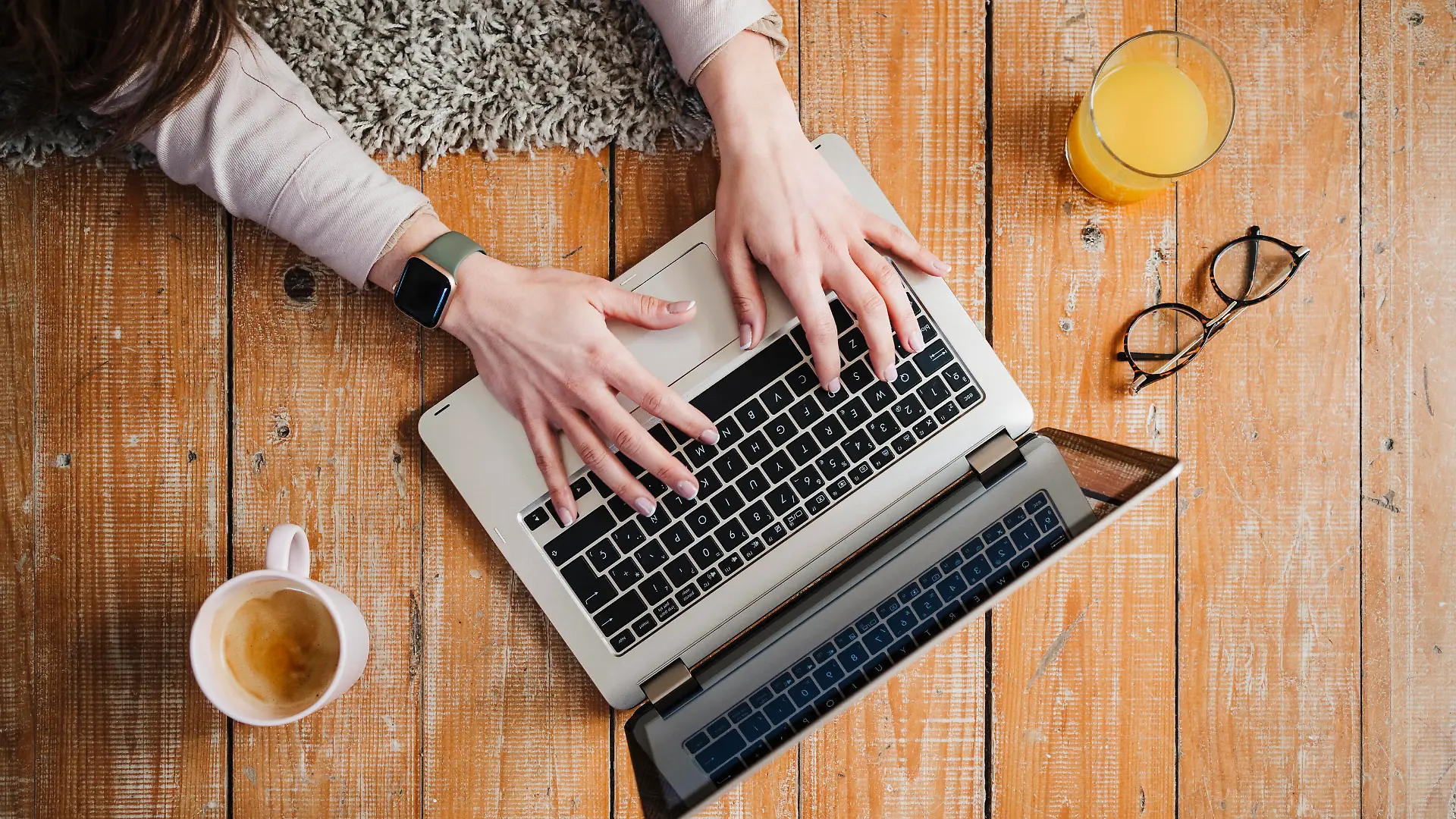 Hands of female entrepreneur typing while using laptop at home model released Symbolfoto property released EBBF02906