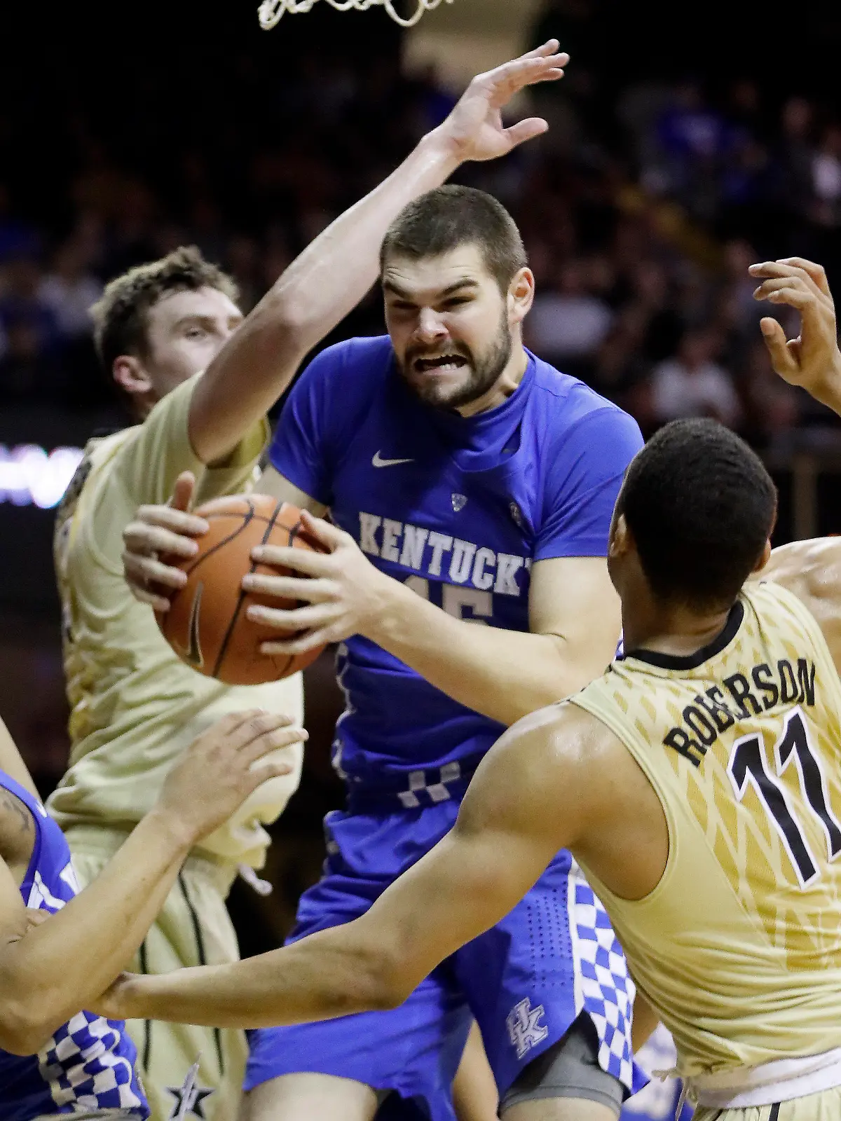 FILE - Kentucky forward Isaac Humphries, center, grabs a rebound in front of Vanderbilt's Luke Kornet, second from left, and Jeff Roberson (11) during the first half of an NCAA college basketball game on Jan. 10, 2017, in Nashville, Tenn. Melbourne United starting center Isaac Humphries has announced that he is gay and said he hopes his decision to publicly announce his sexuality will lead to more professional sportsmen doing the same. (AP Photo/Mark Humphrey, File)