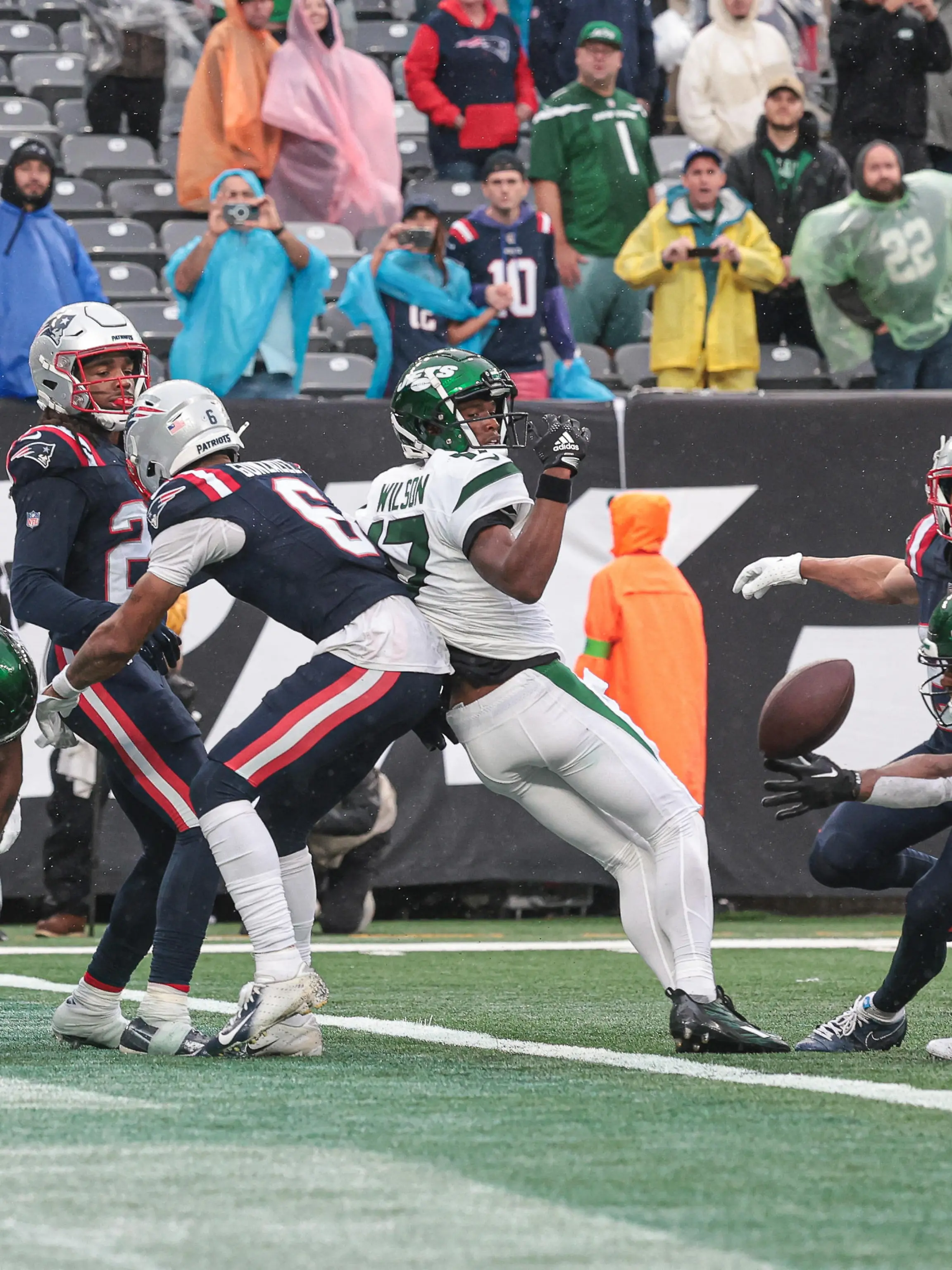Sep 24, 2023; East Rutherford, New Jersey, USA; New York Jets wide receiver Randall Cobb (18) is unable to make a catch in front of New England Patriots defenders as time expires at MetLife Stadium. Mandatory Credit: Vincent Carchietta-USA TODAY Sports