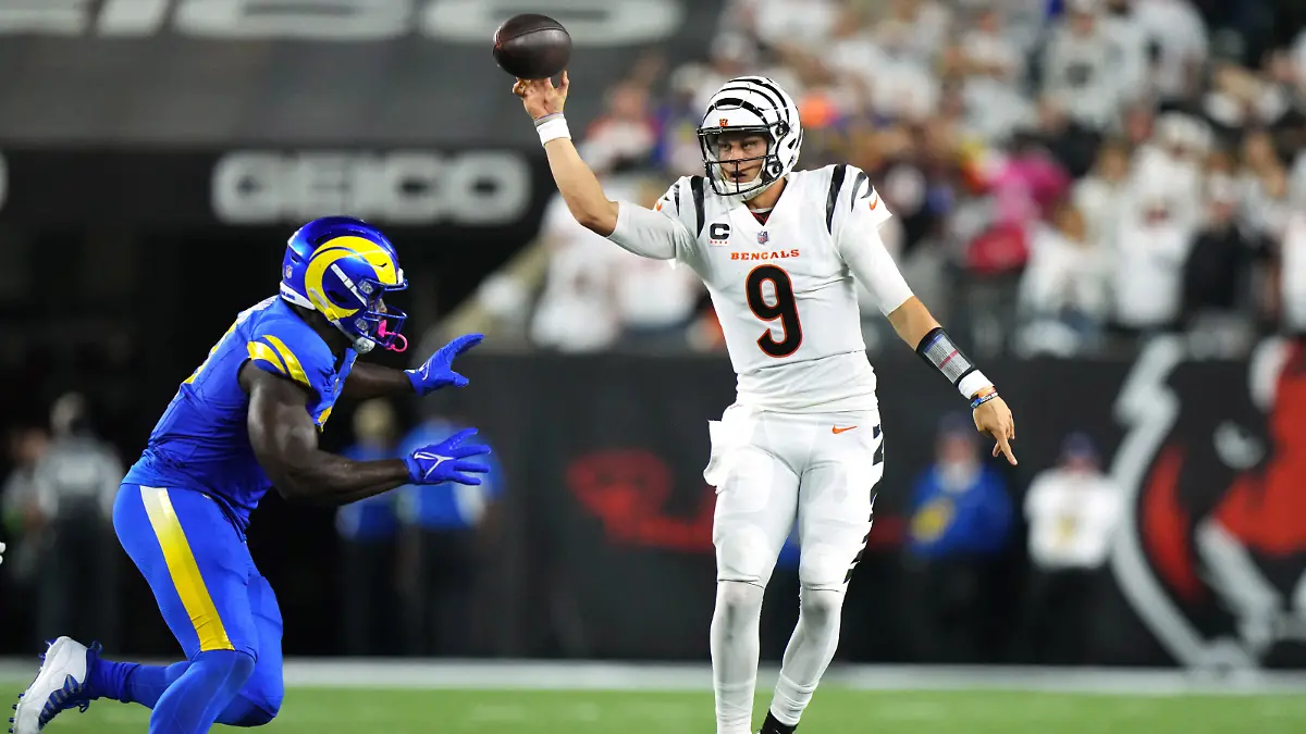 Sep 25, 2023; Cincinnati, Ohio, USA; Cincinnati Bengals quarterback Joe Burrow (9) rolls out of the pocket to throw in the third quarter during a Week 3 NFL football game between the Los Angeles Rams and the Cincinnati Bengals at Paycor Stadium. Mandatory Credit: Kareem Elgazzar-USA TODAY Sports