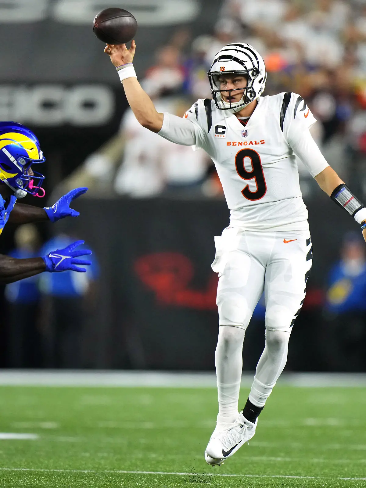 Sep 25, 2023; Cincinnati, Ohio, USA; Cincinnati Bengals quarterback Joe Burrow (9) rolls out of the pocket to throw in the third quarter during a Week 3 NFL football game between the Los Angeles Rams and the Cincinnati Bengals at Paycor Stadium. Mandatory Credit: Kareem Elgazzar-USA TODAY Sports